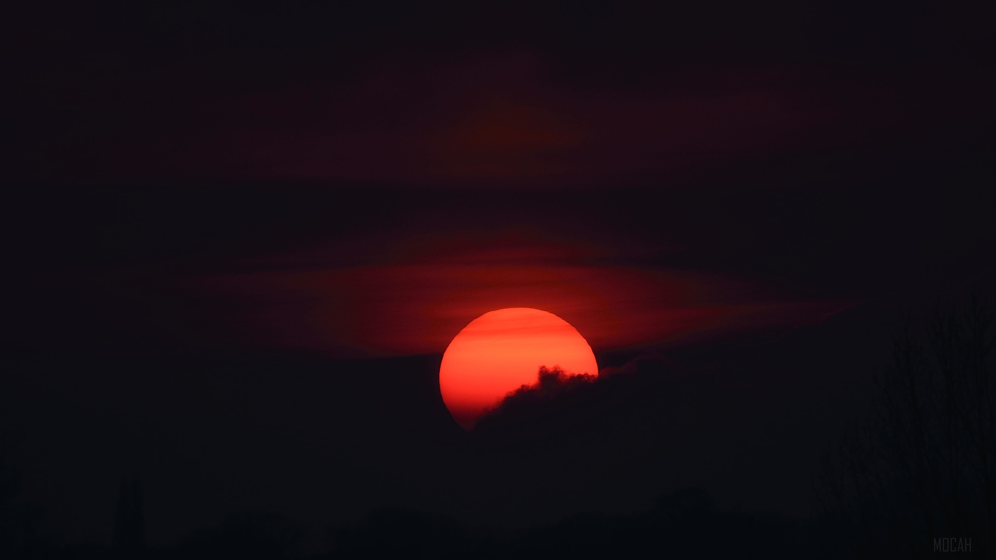 Sunset behind dark clouds 4K HD Wallpaper