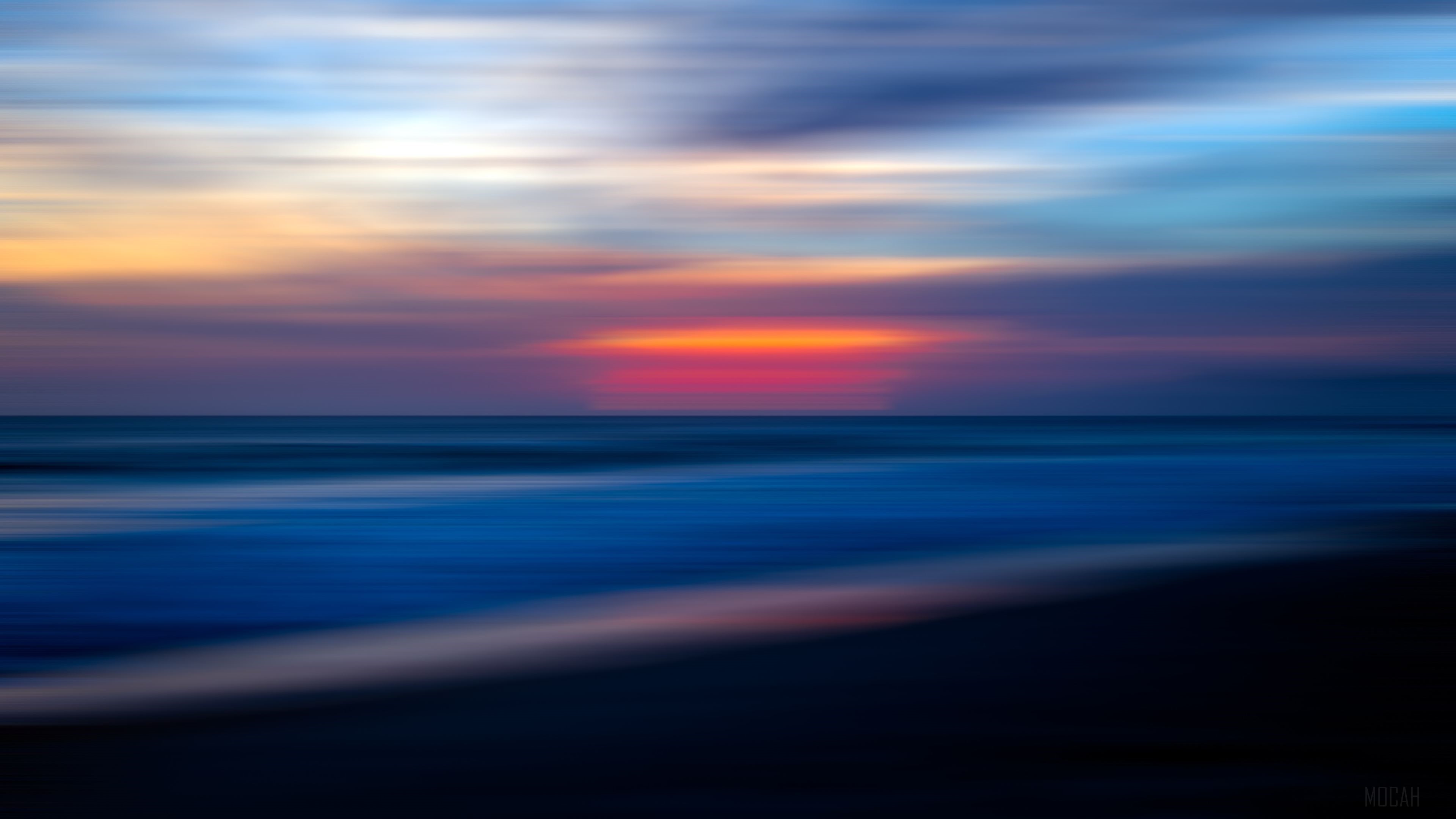 Blurry Sunset Over the Ocean HD Wallpaper