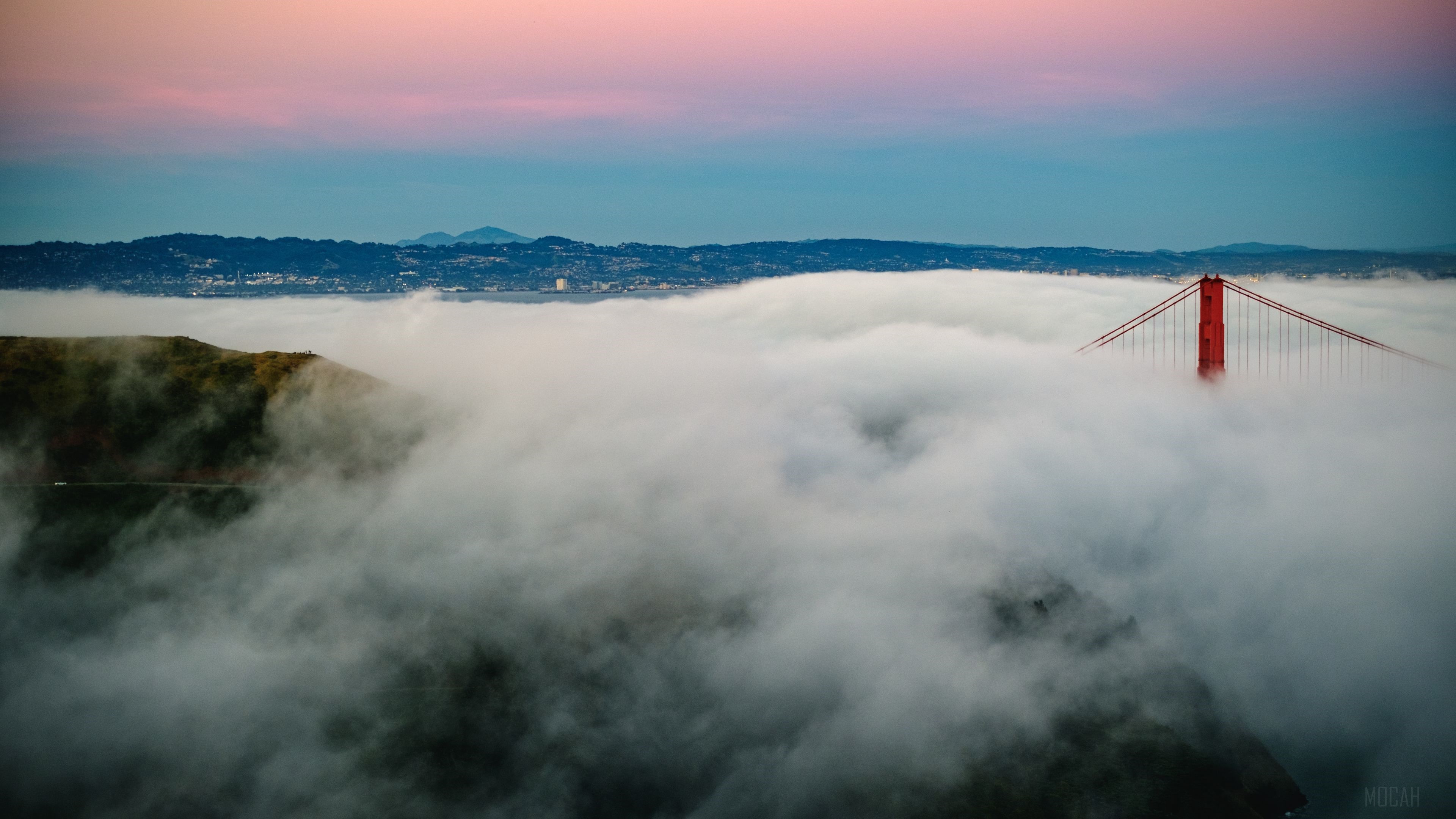 Golden Gate Bridge shrouded in fog at sunrise HD Wallpaper