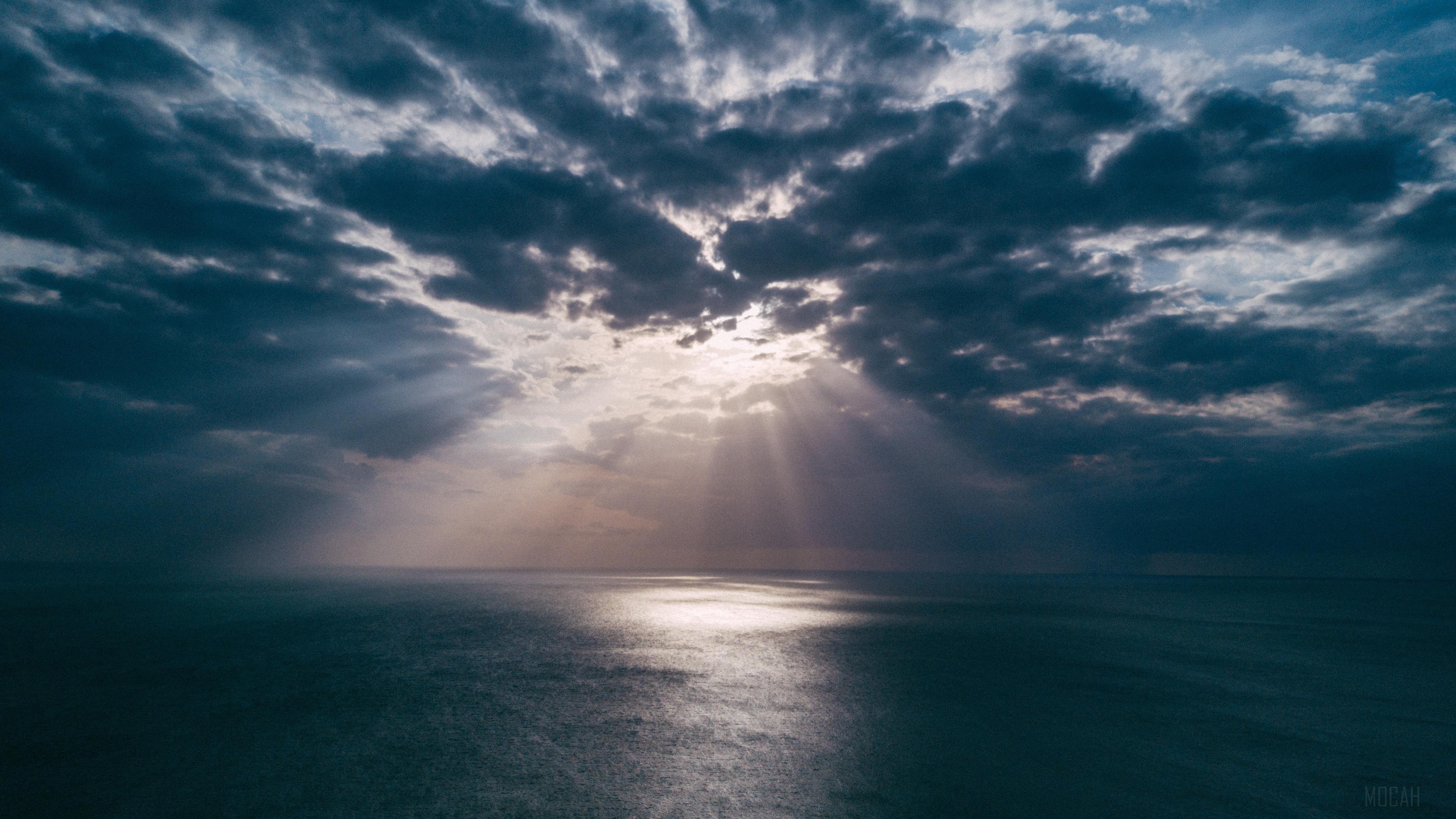 Sun Rays Breaking Through Clouds Over Ocean HD Wallpaper