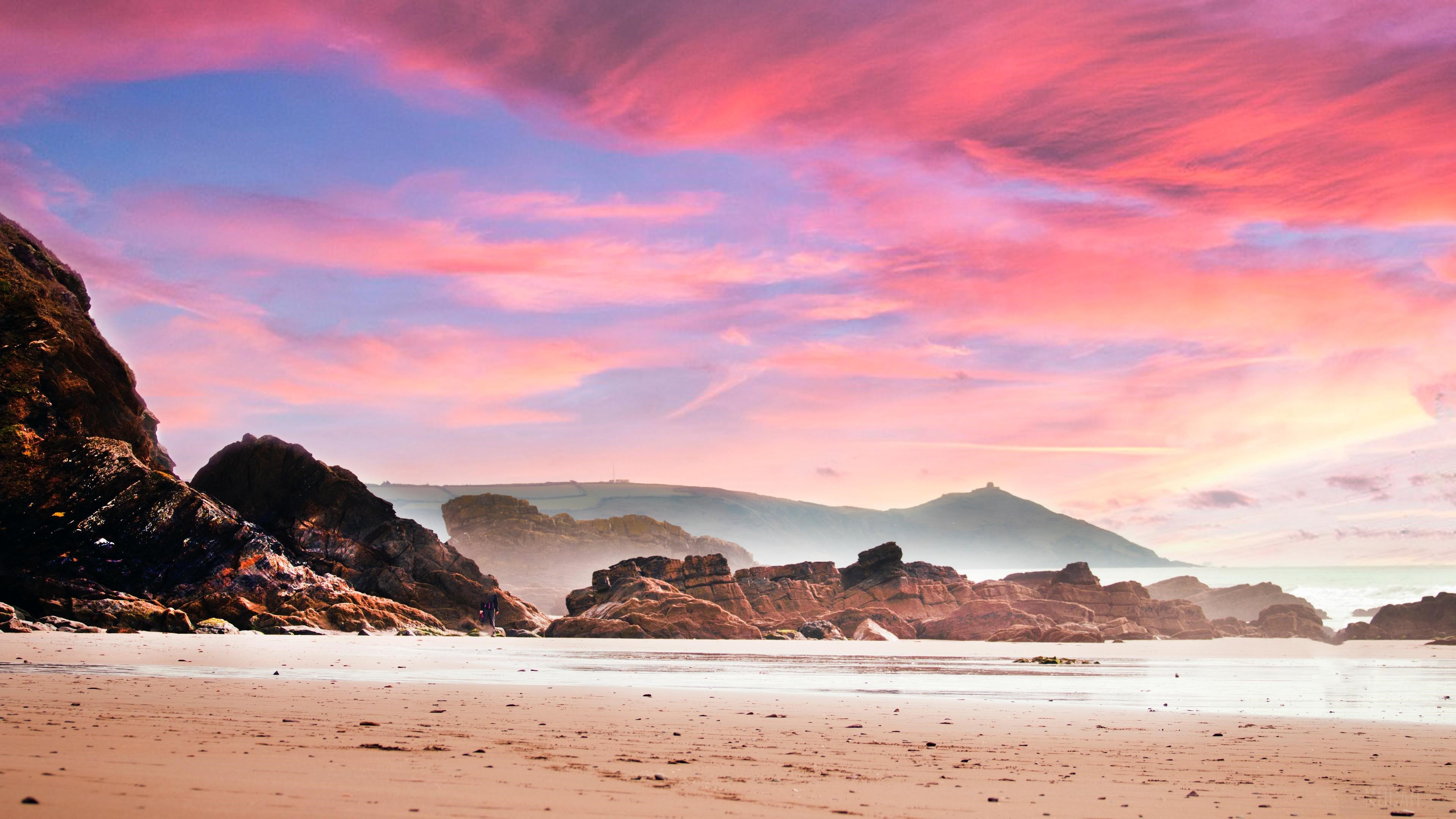 Beach with Rocks and Pink Sunset Sky 4K HD Wallpaper
