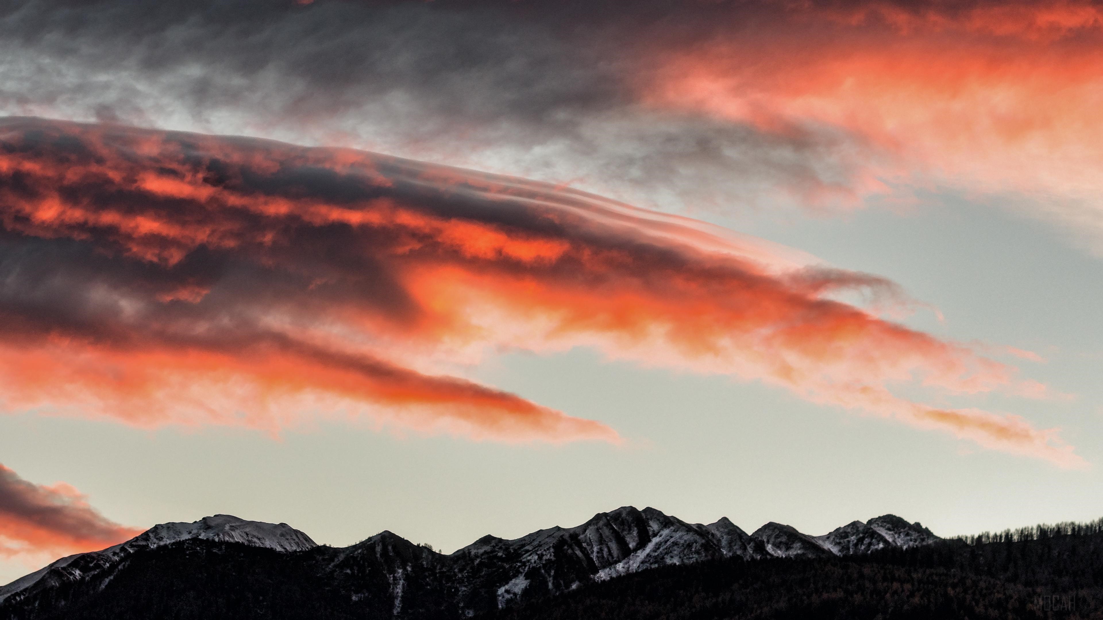 Sunset clouds over snow-capped mountains HD Wallpaper