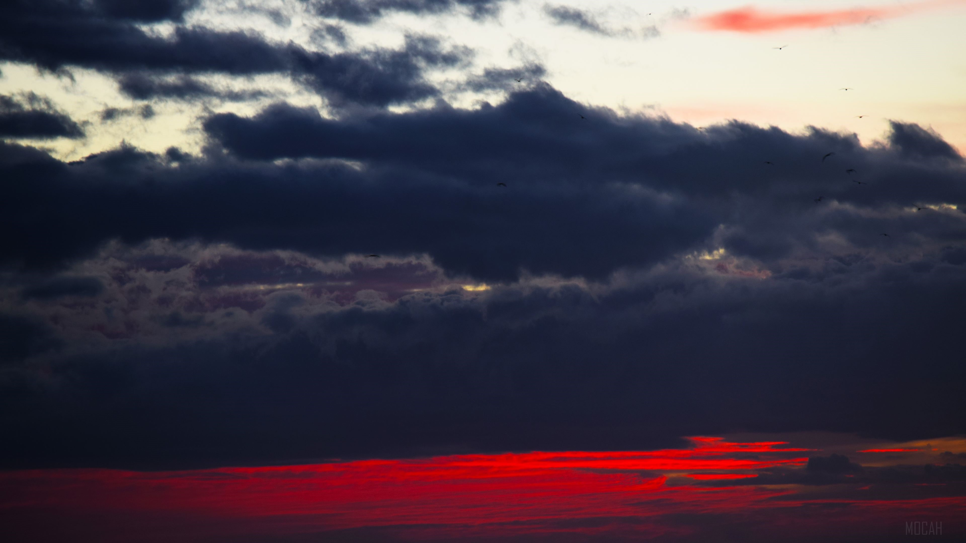 Dark Clouds Over Red Sunset 4K HD Wallpaper