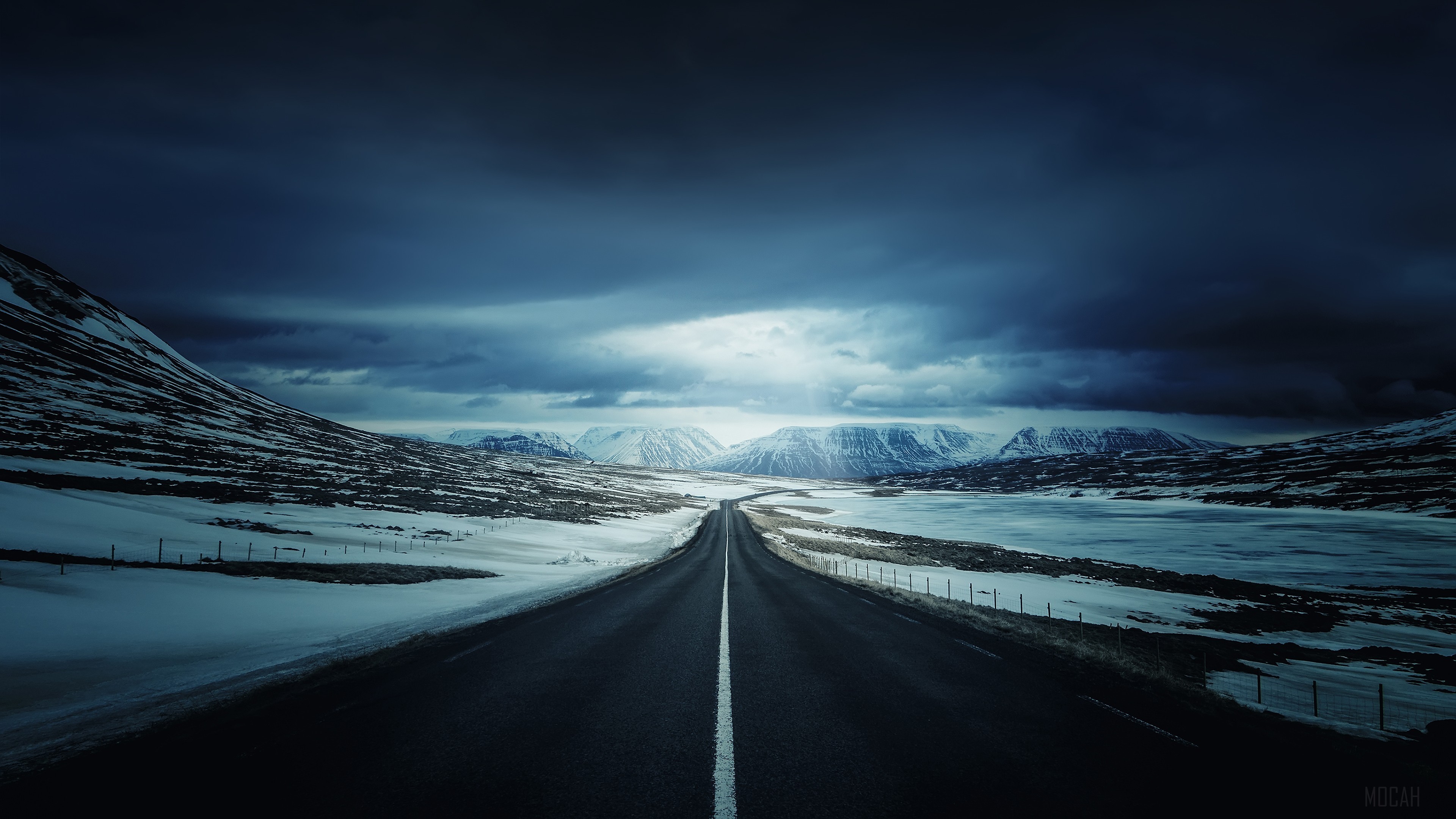 Road through Iceland landscape with mountains and clouds 4K HD Wallpaper
