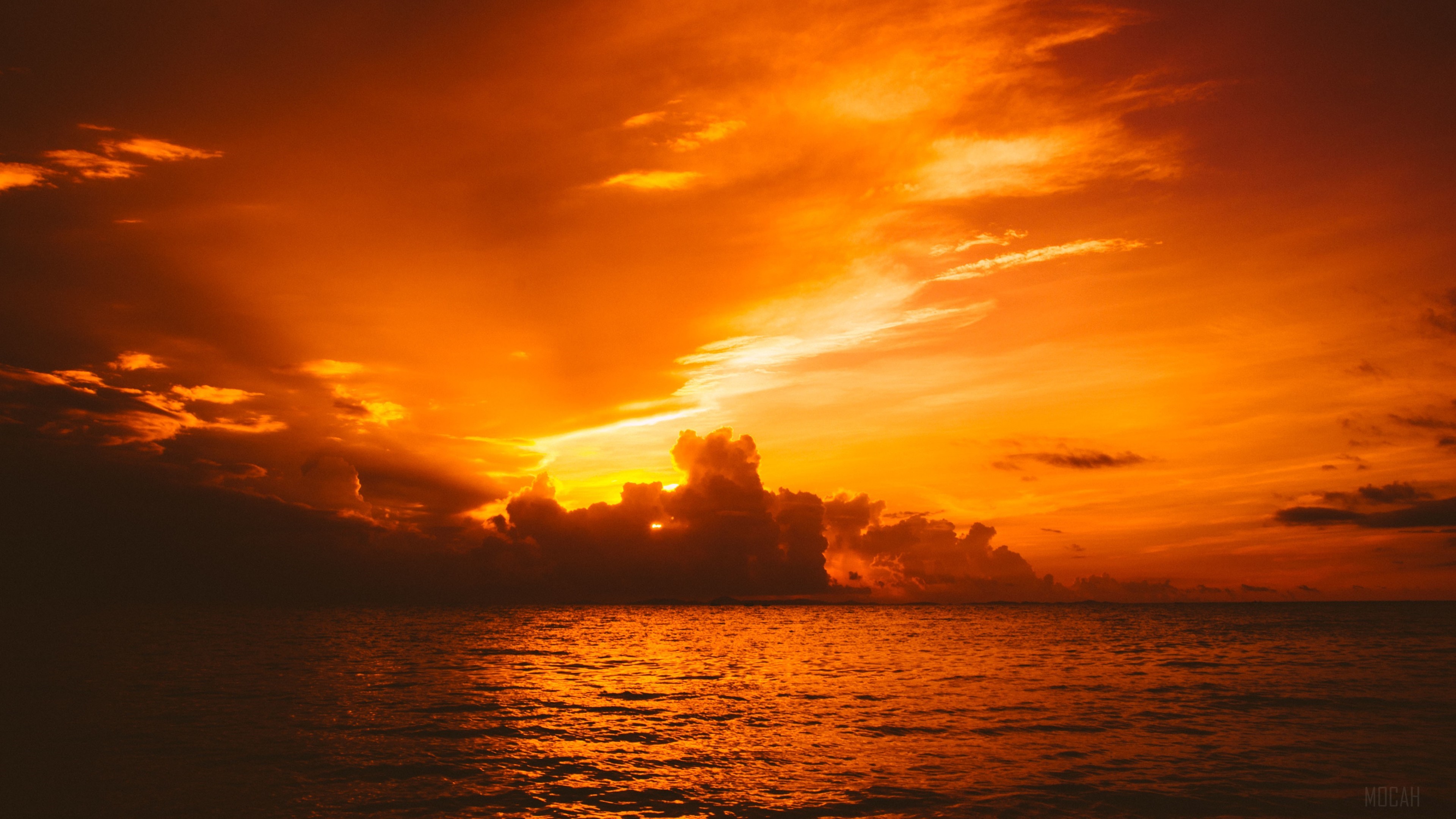 Sunset over the sea with dramatic clouds HD Wallpaper