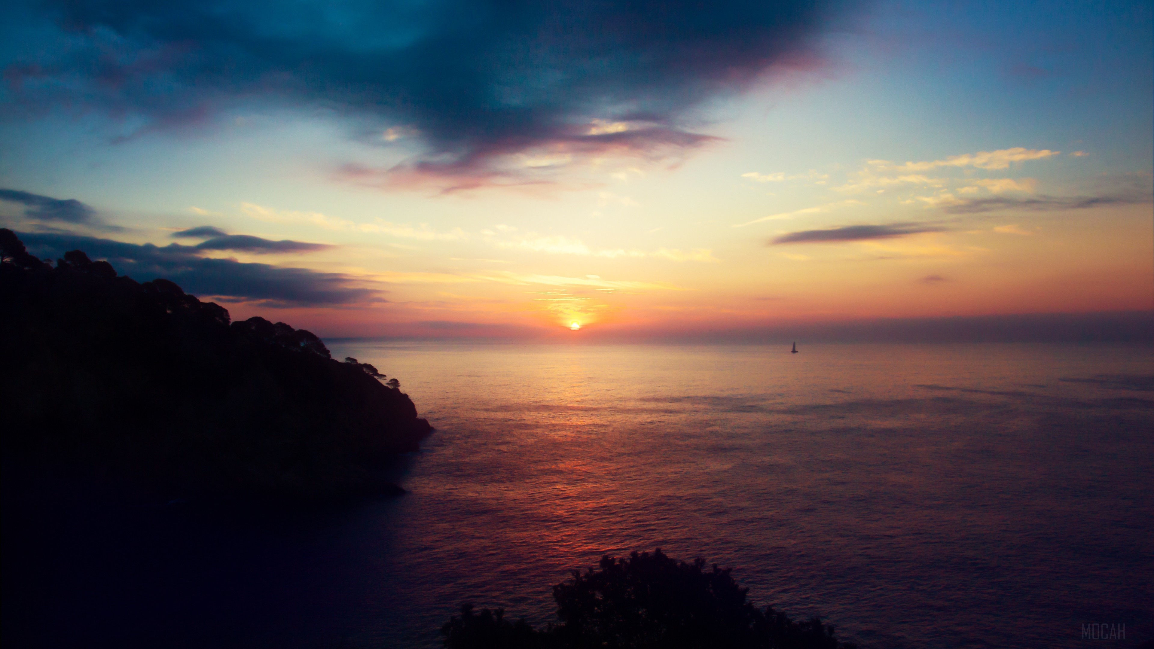 Sunset over the sea with a sailboat HD Wallpaper