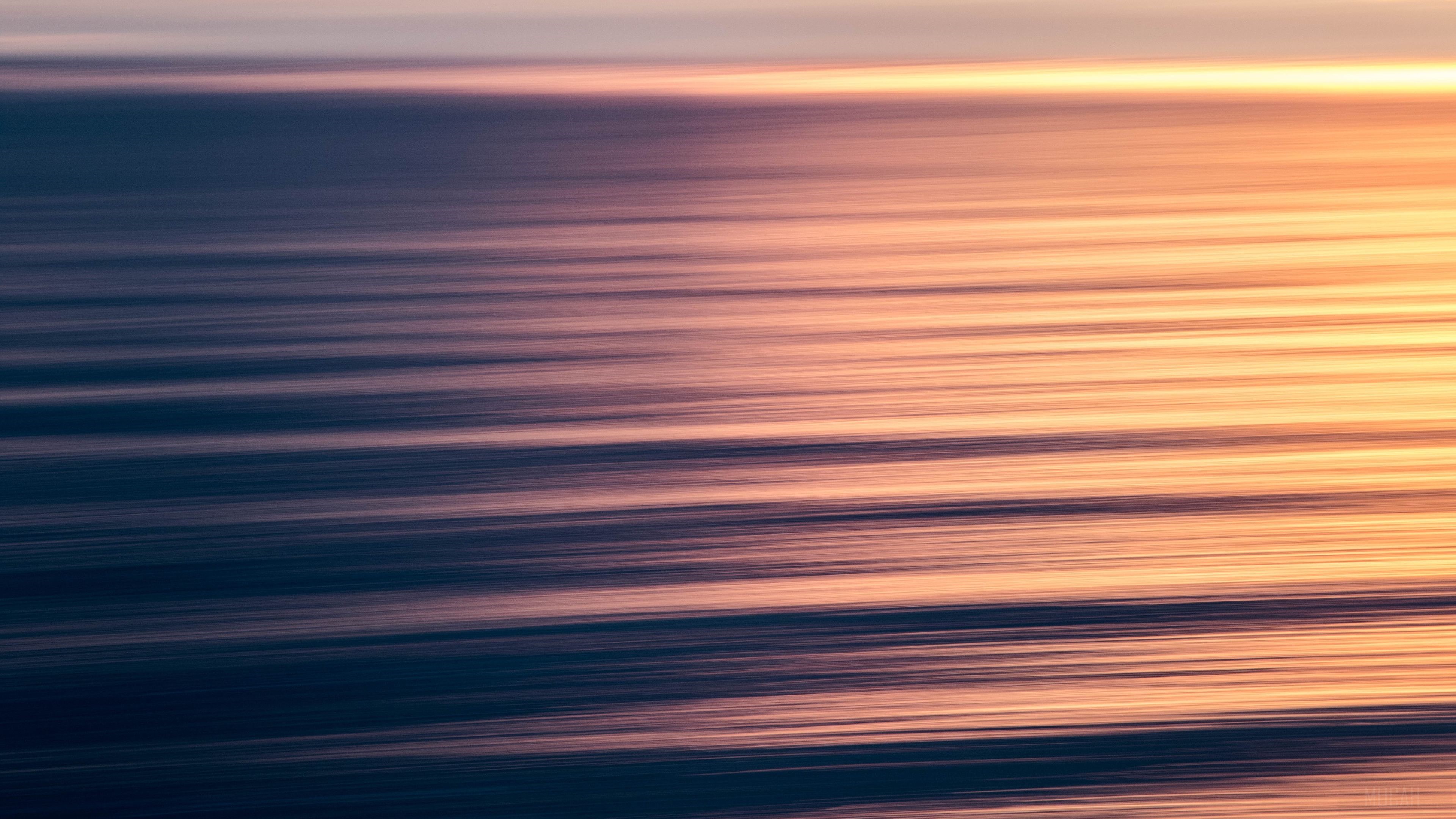 Ocean waves with sunset light 4K HD Wallpaper