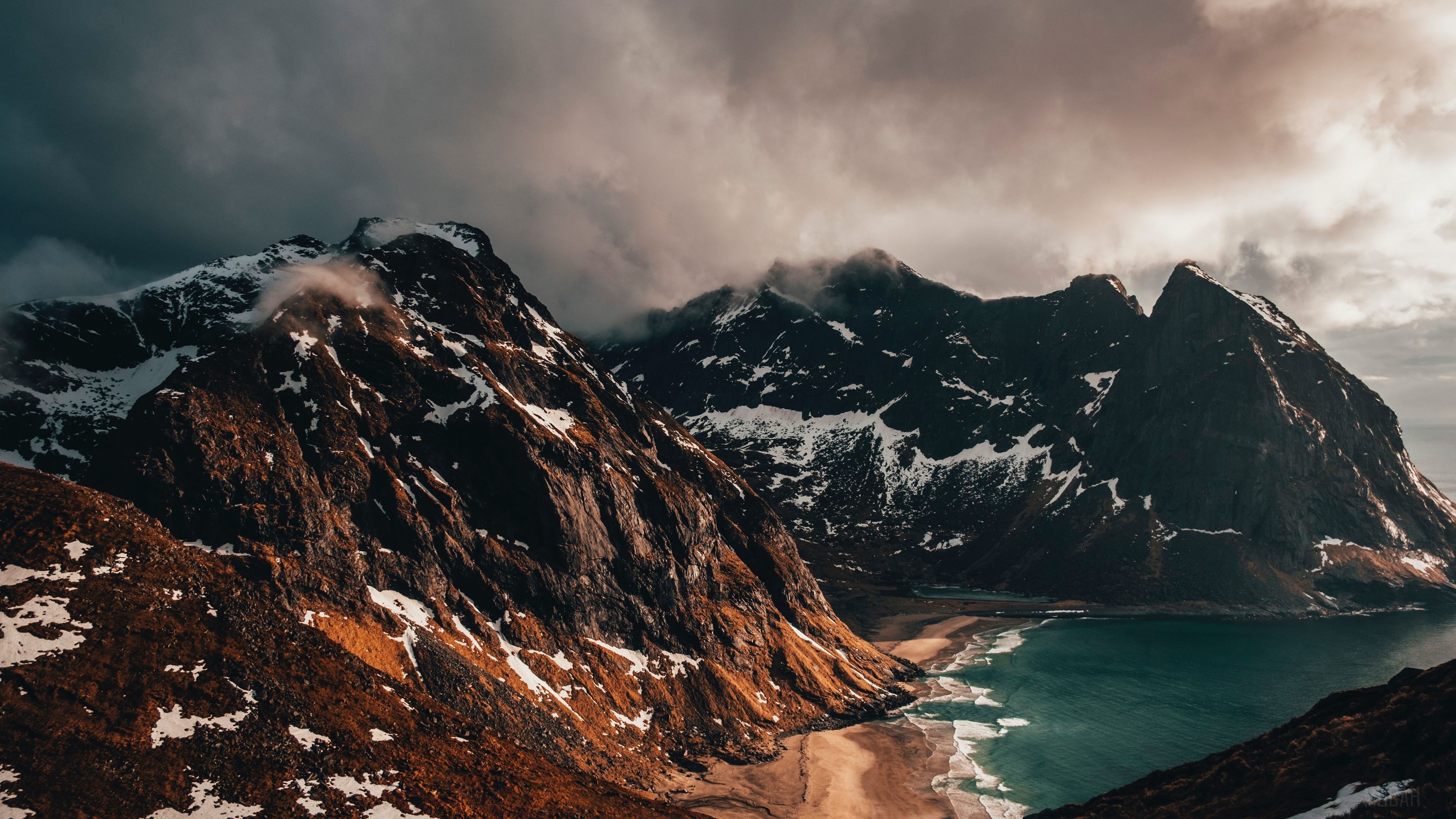 Snow-Covered Peaky Mountains and Coastline 4K HD Wallpaper