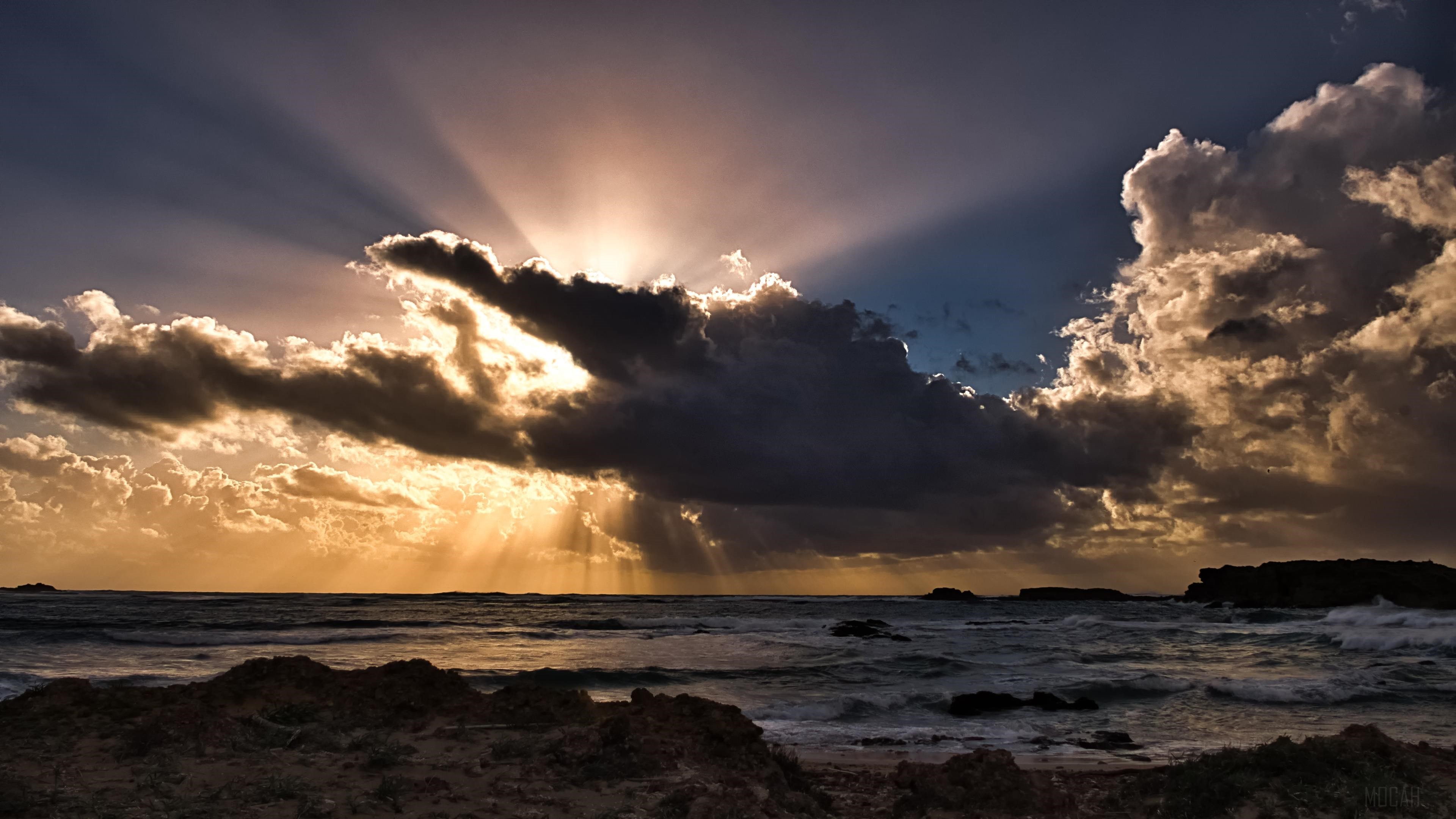 Sun Rays Passing Through Clouds Over Ocean 4K HD Wallpaper