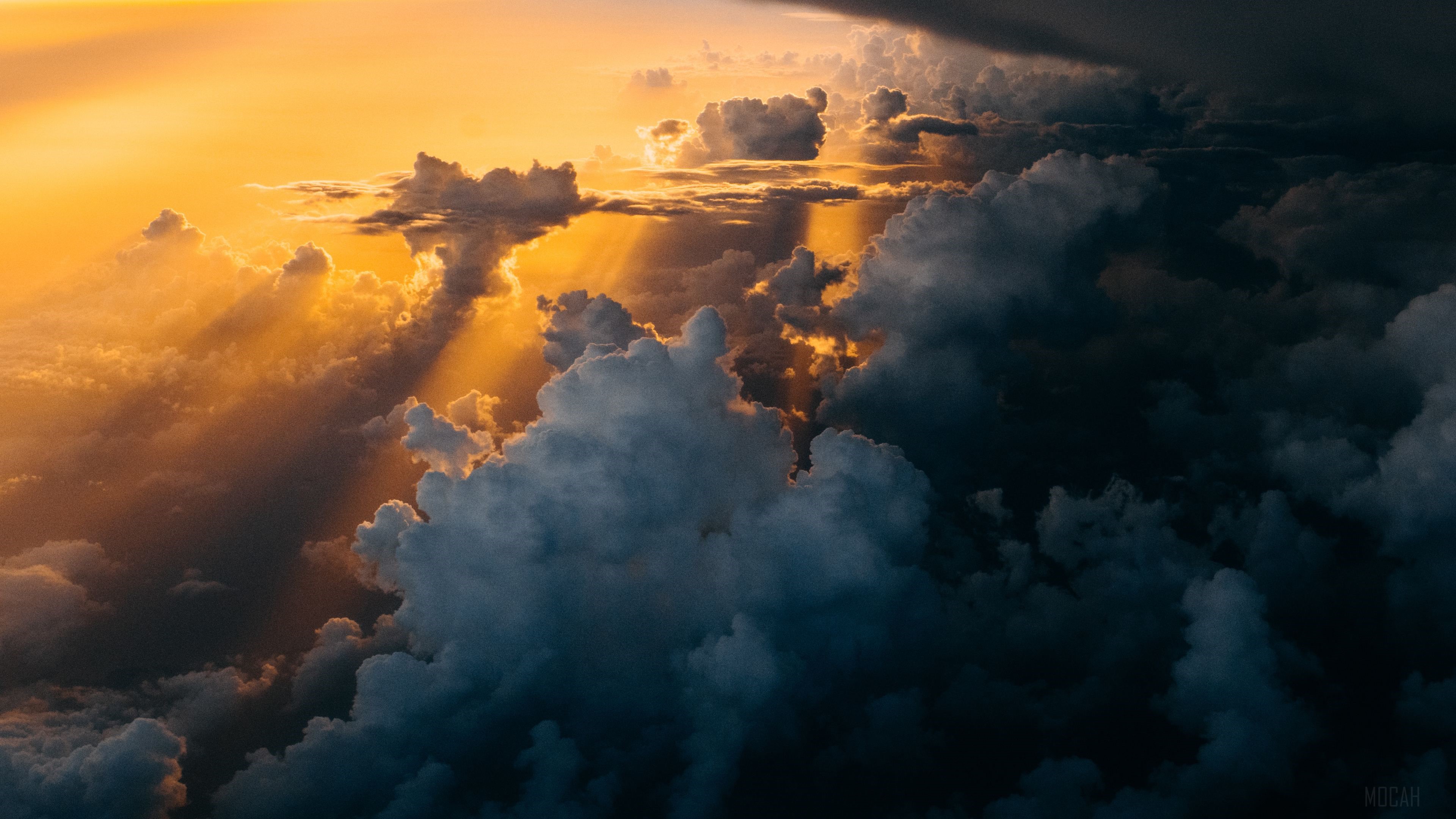 Sunlight beams through dark and bright clouds HD Wallpaper