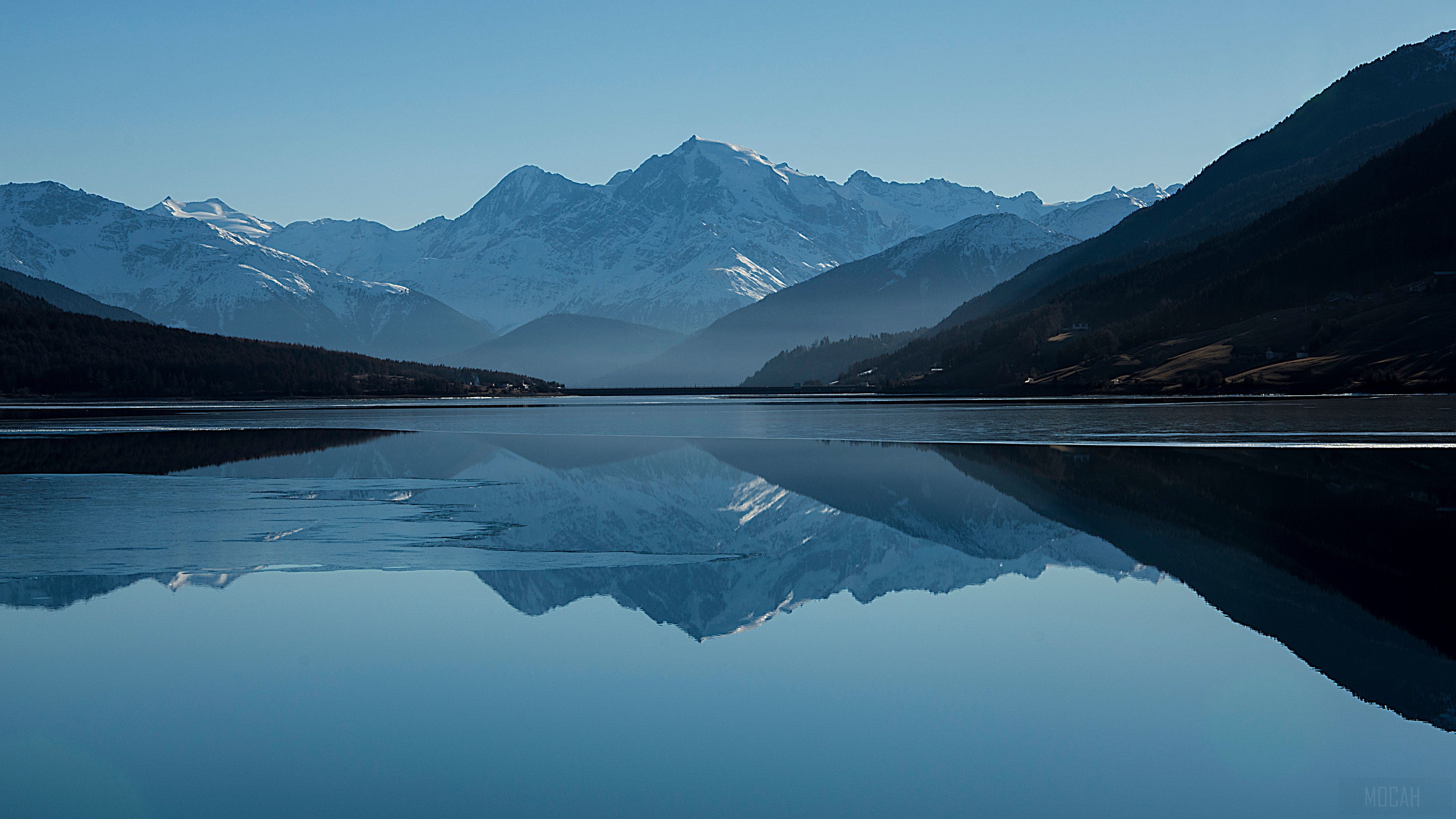 Snowy Mountain Peaks Reflected in a Calm Lake HD Wallpaper