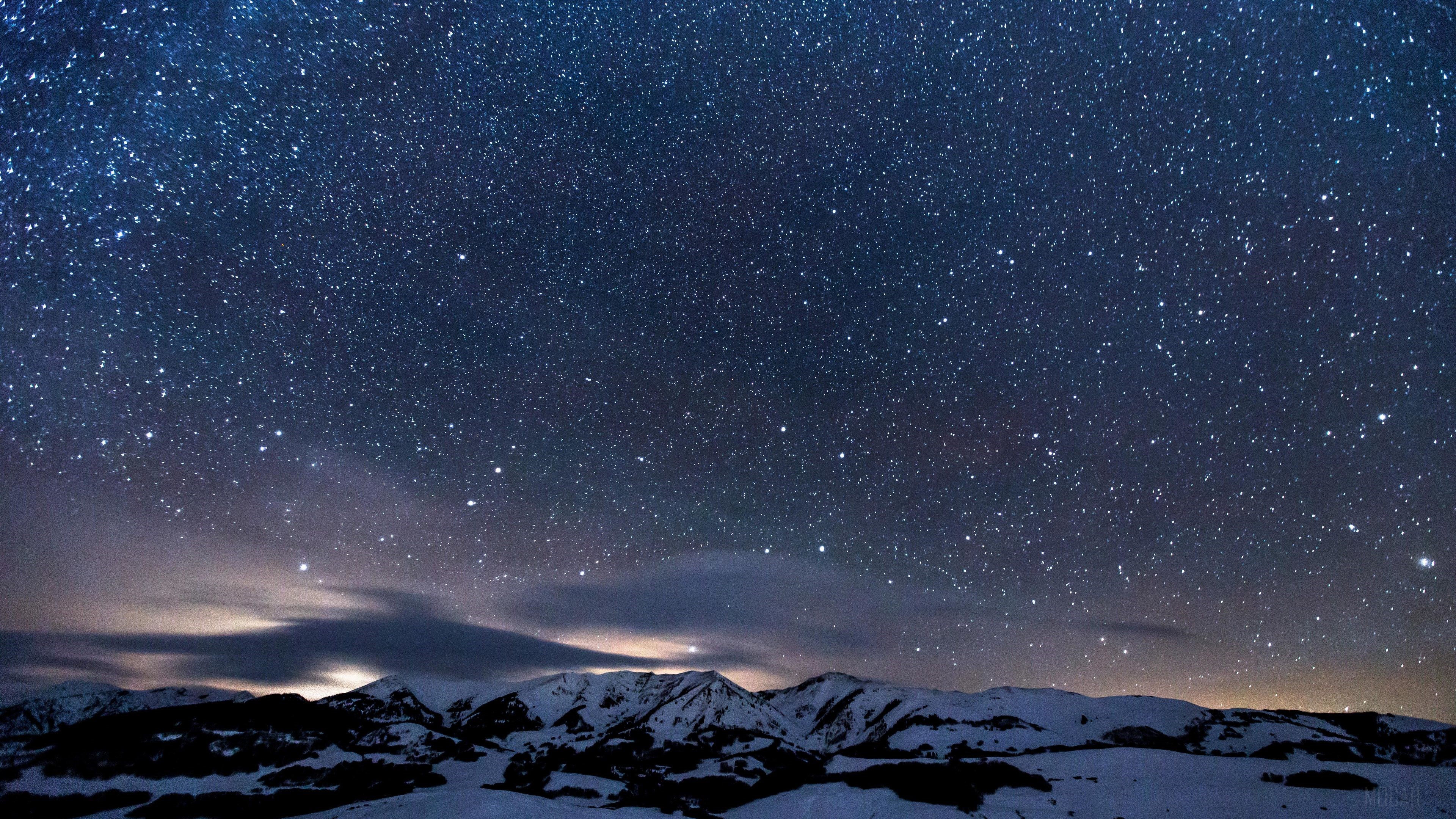 Sky Full of Stars Over Snowy Mountains 4K HD Wallpaper