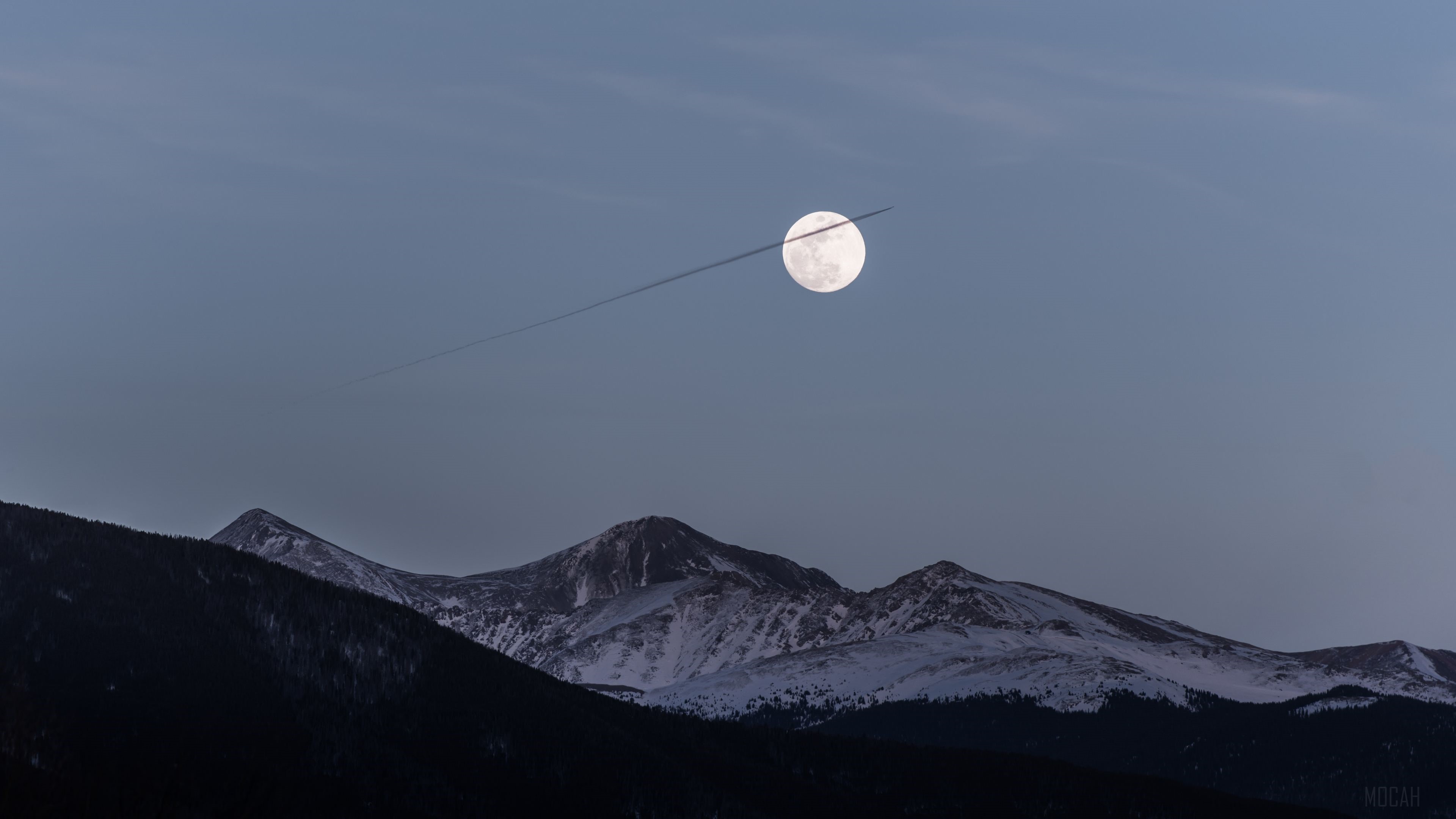 Moon and Airplane Trail Over Snowy Mountains HD Wallpaper