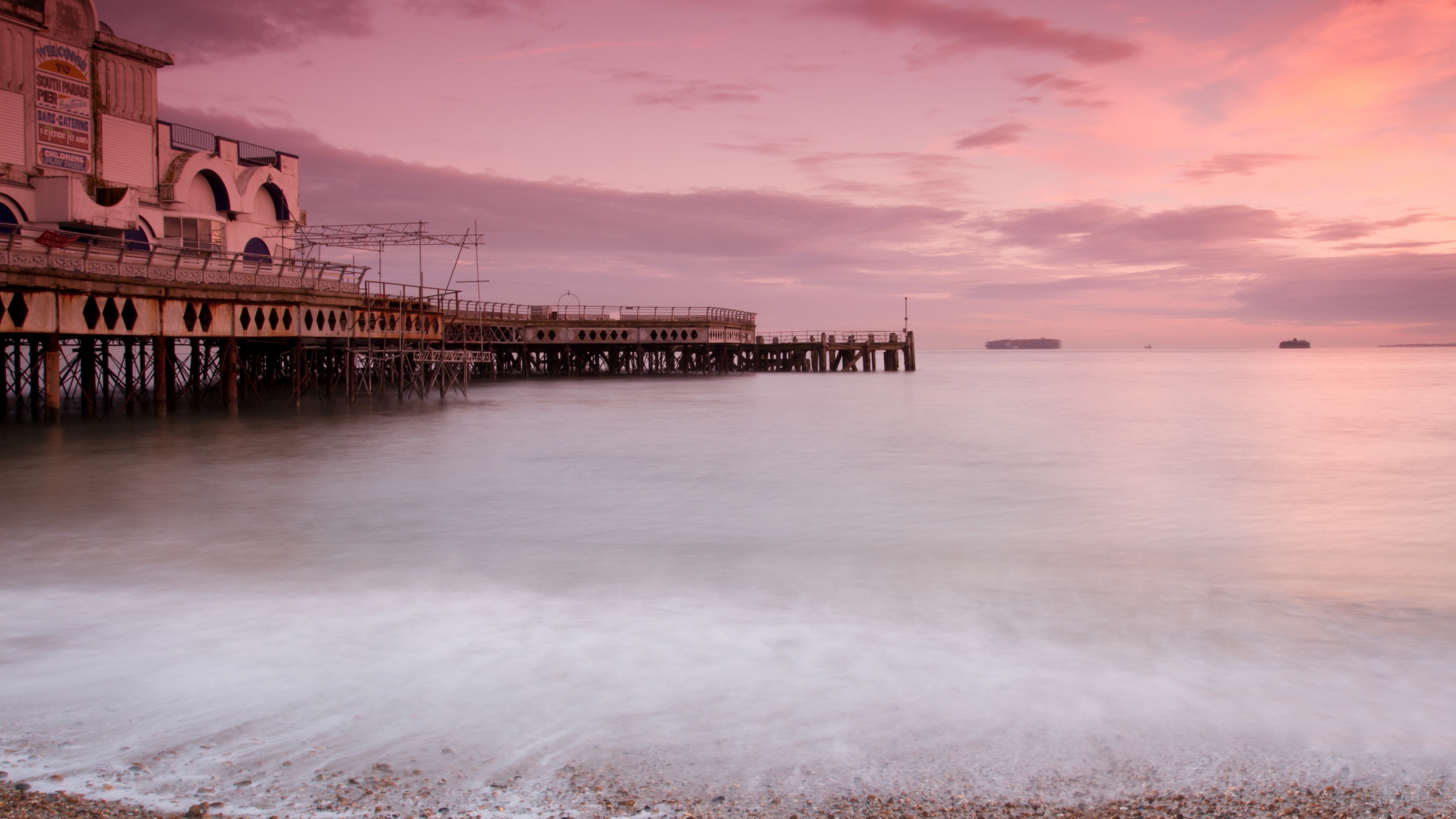 Pier at Sunset with Ships on the Horizon HD Wallpaper