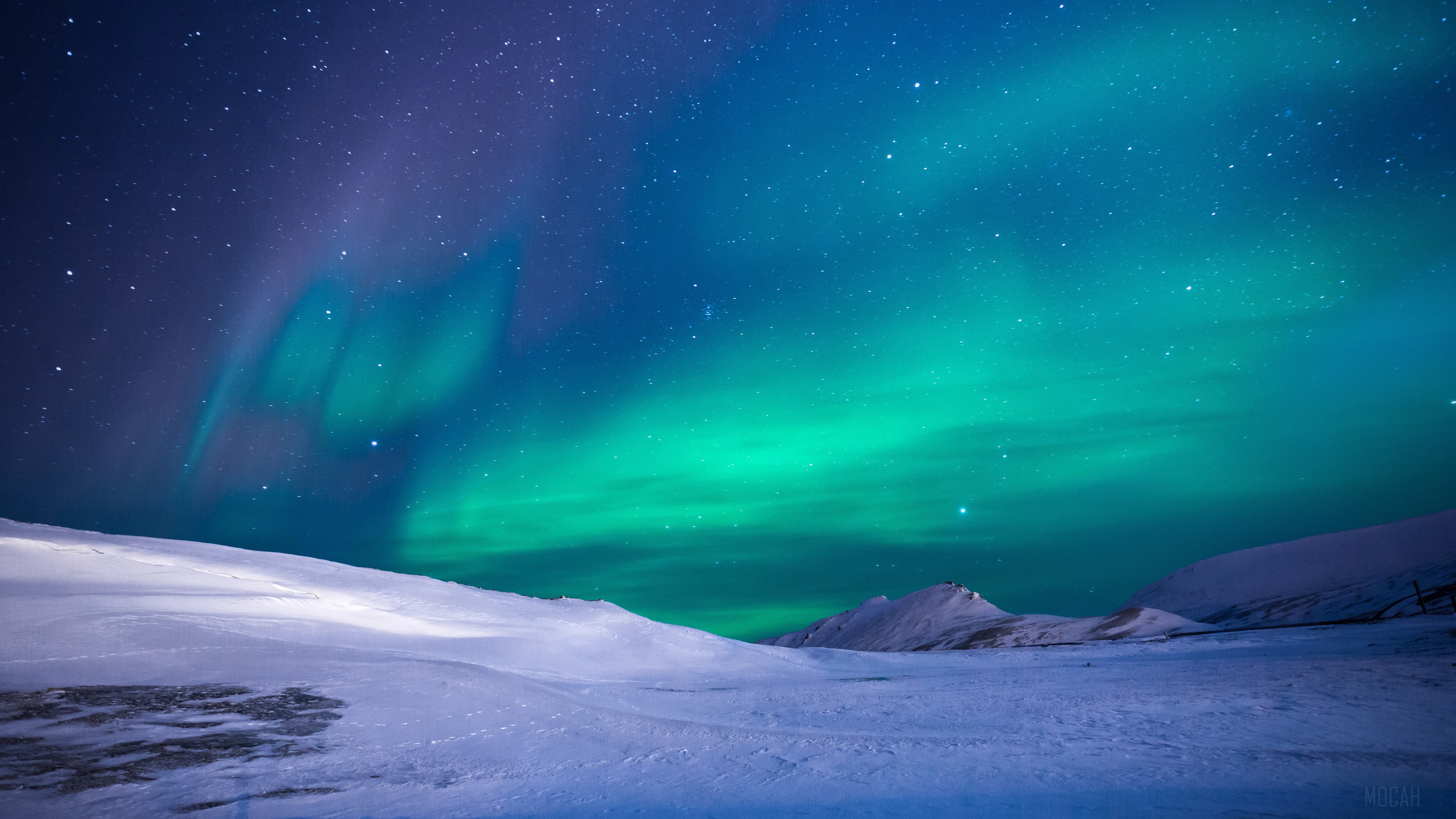 Aurora Borealis over Snowy Landscape 4K HD Wallpaper