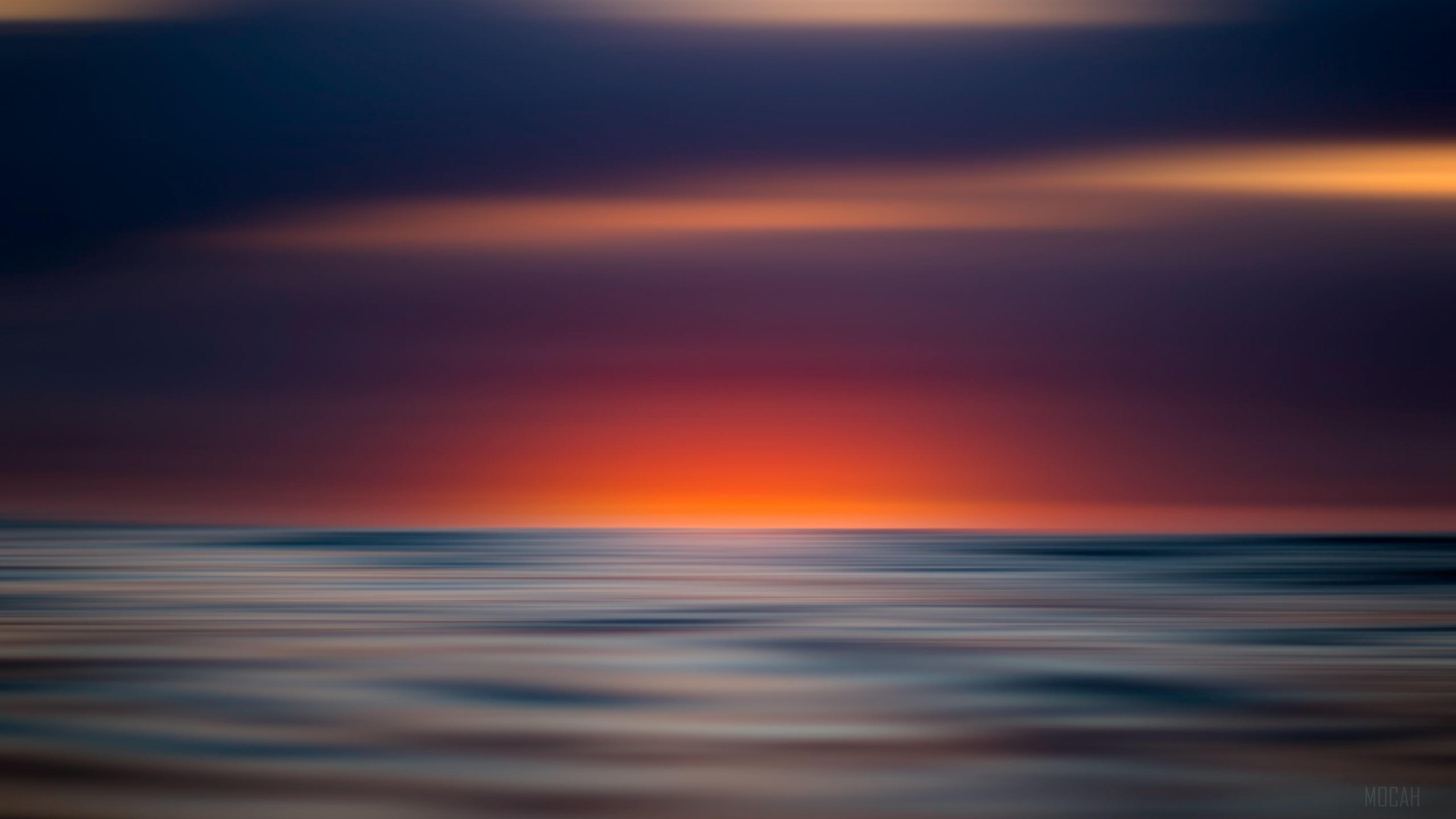 Blurry Sunset Over the Ocean 4K HD Wallpaper