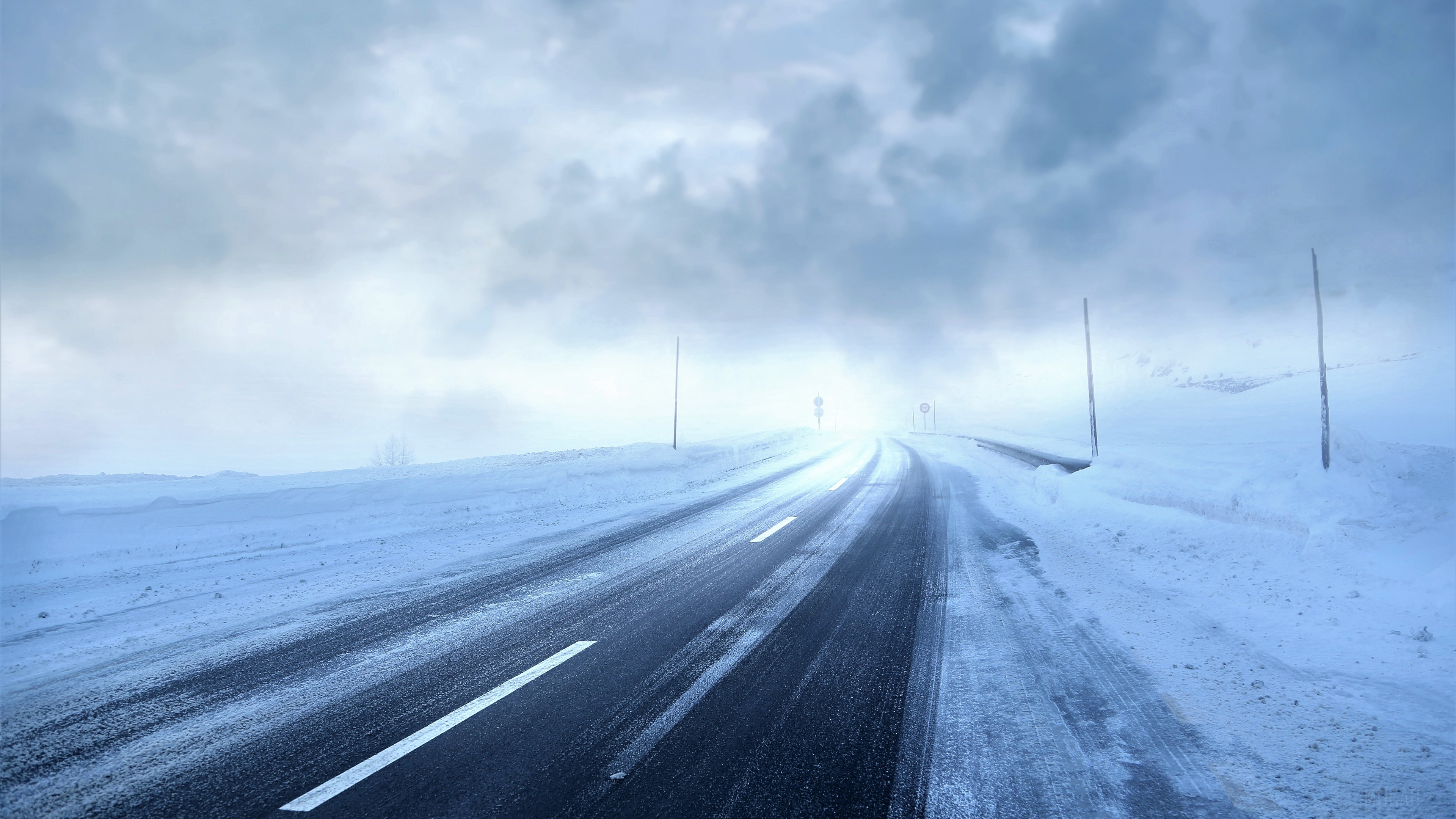 Snow Storm on a Winding Road HD Wallpaper