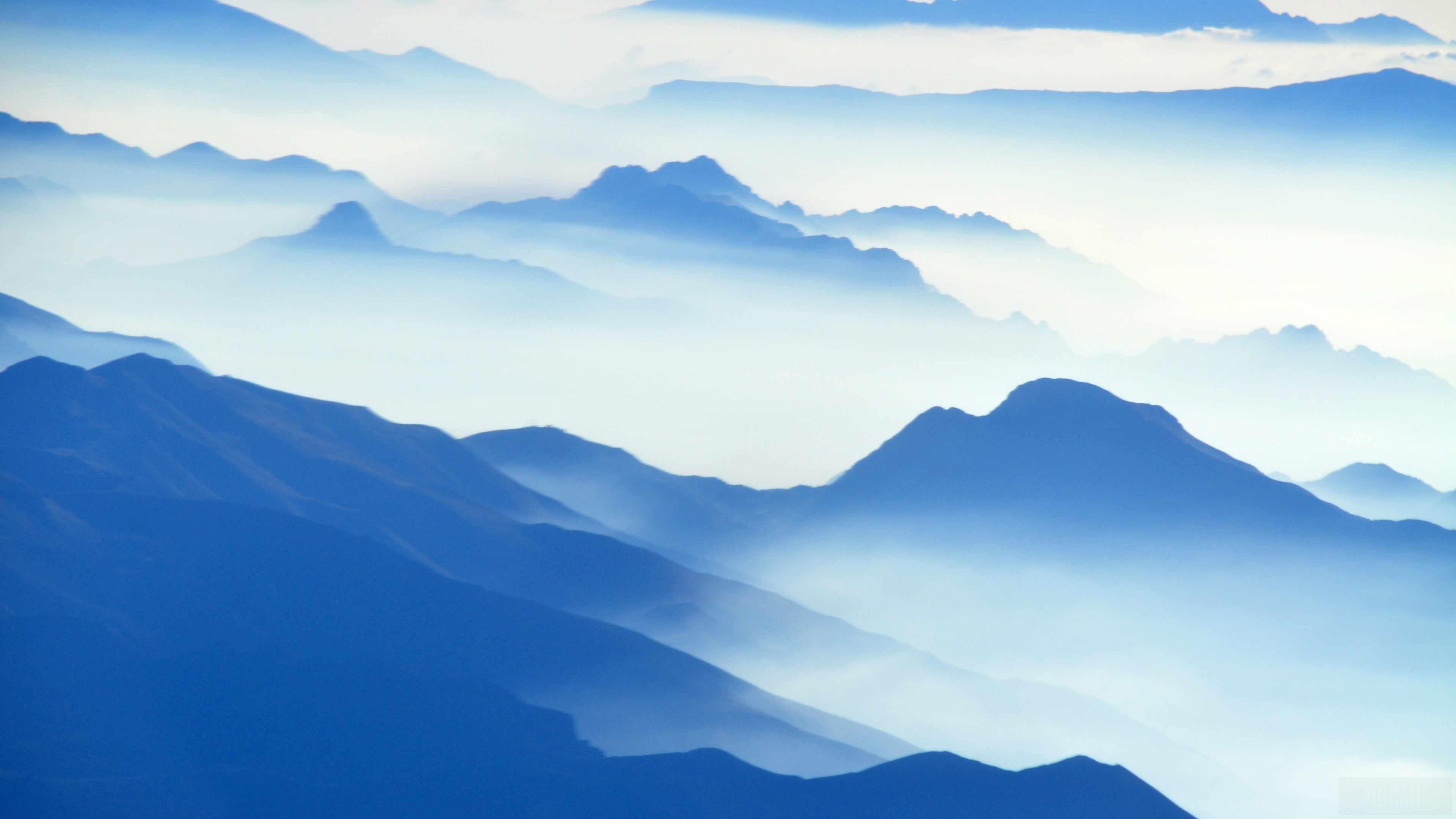 Aerial View Of Mountains In Fog 4K HD Wallpaper