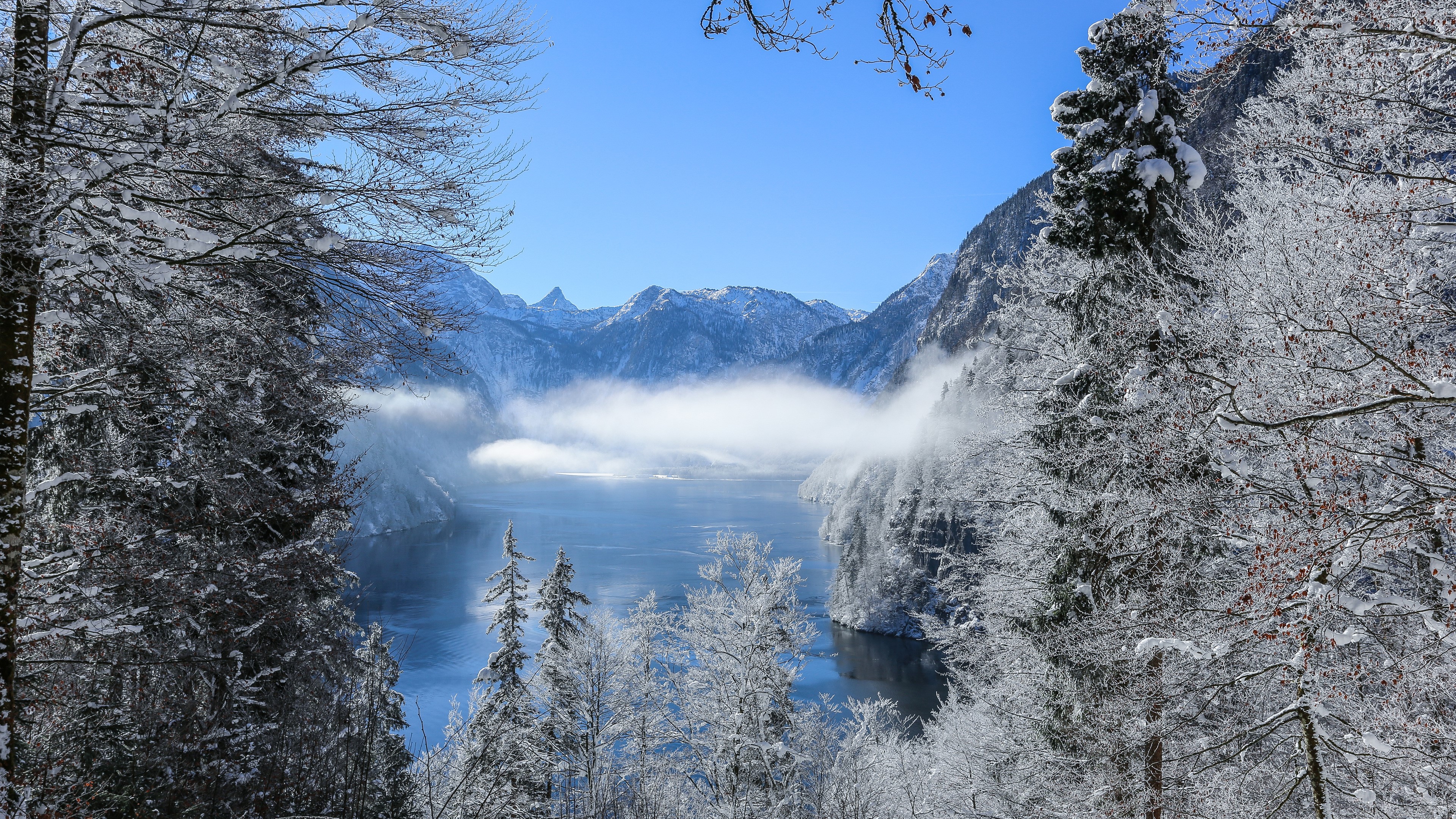 Snow-covered mountains and lake in winter HD Wallpaper