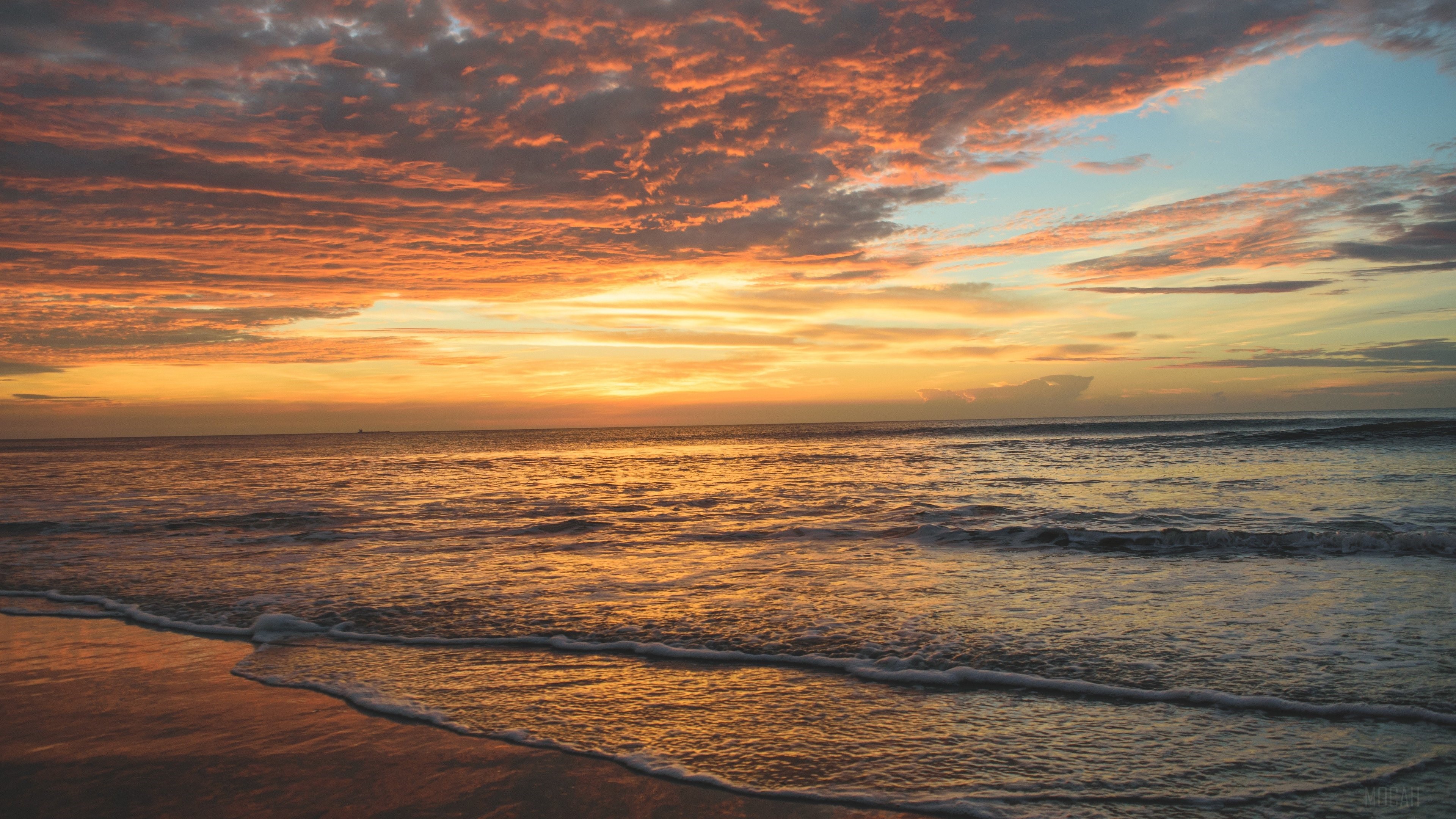 Sunset over the ocean with colorful clouds HD Wallpaper