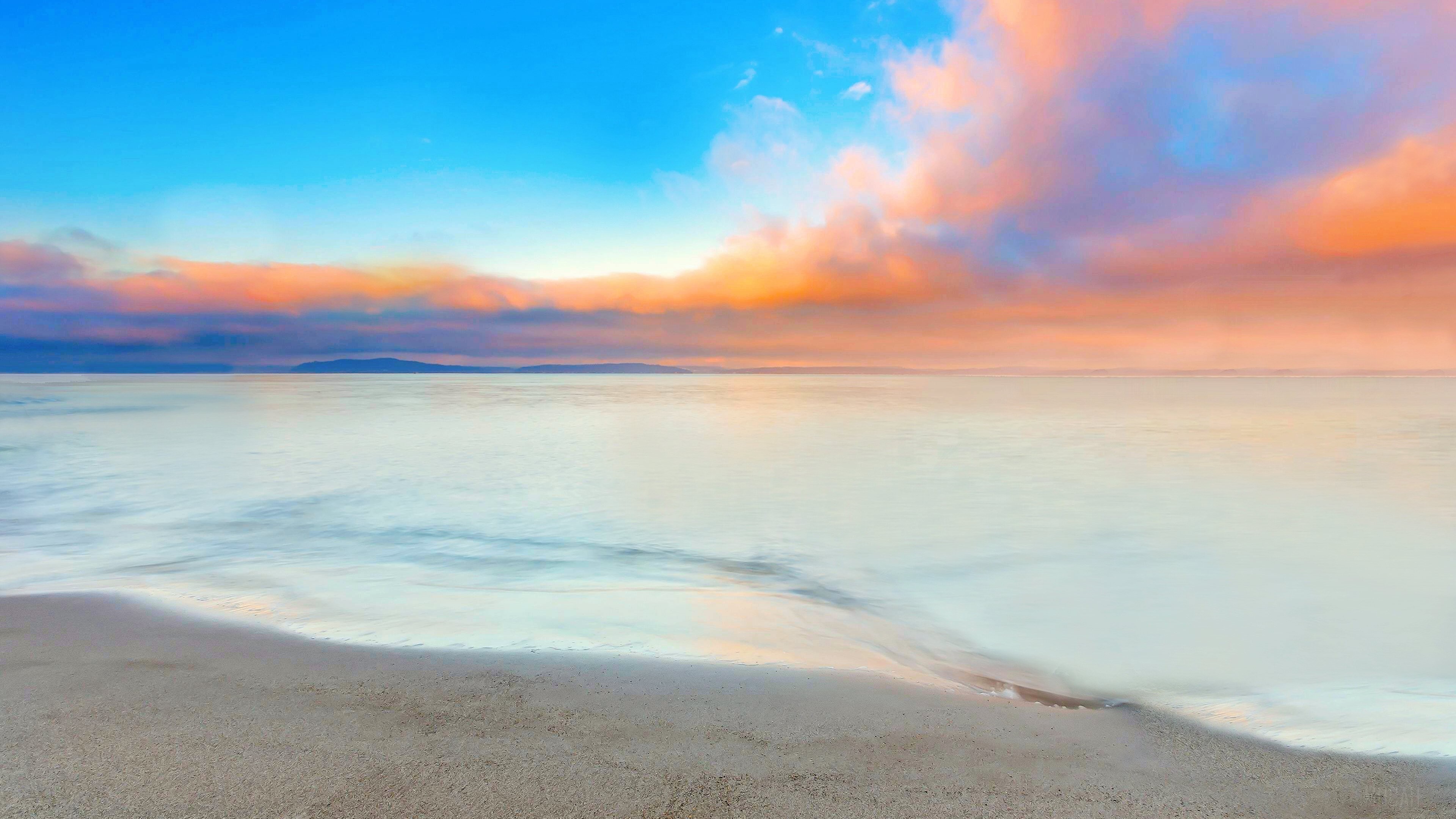 Coastline with colorful clouds at sunset 4K HD Wallpaper