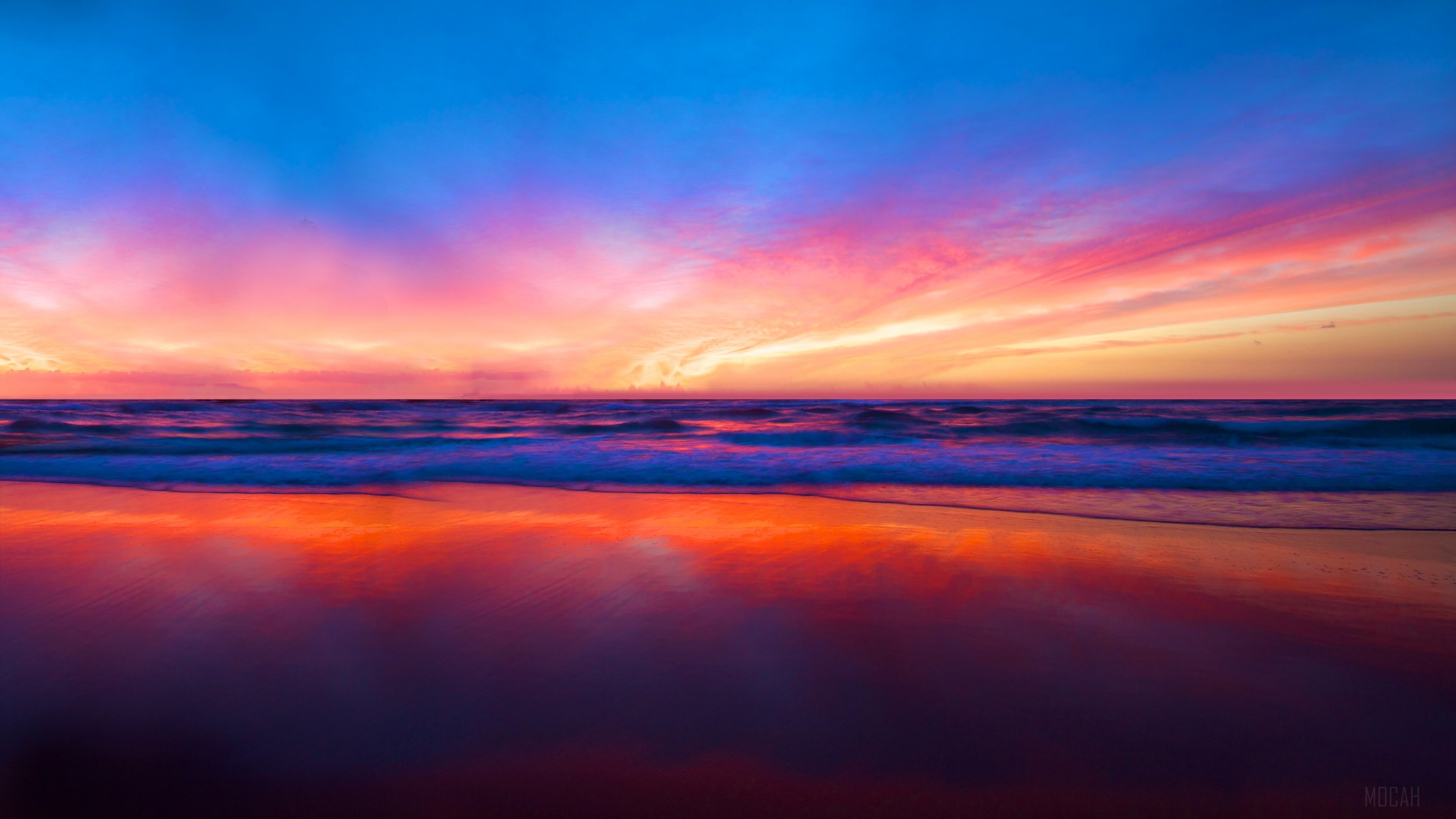 Sunset over the ocean with colorful clouds and reflection HD Wallpaper