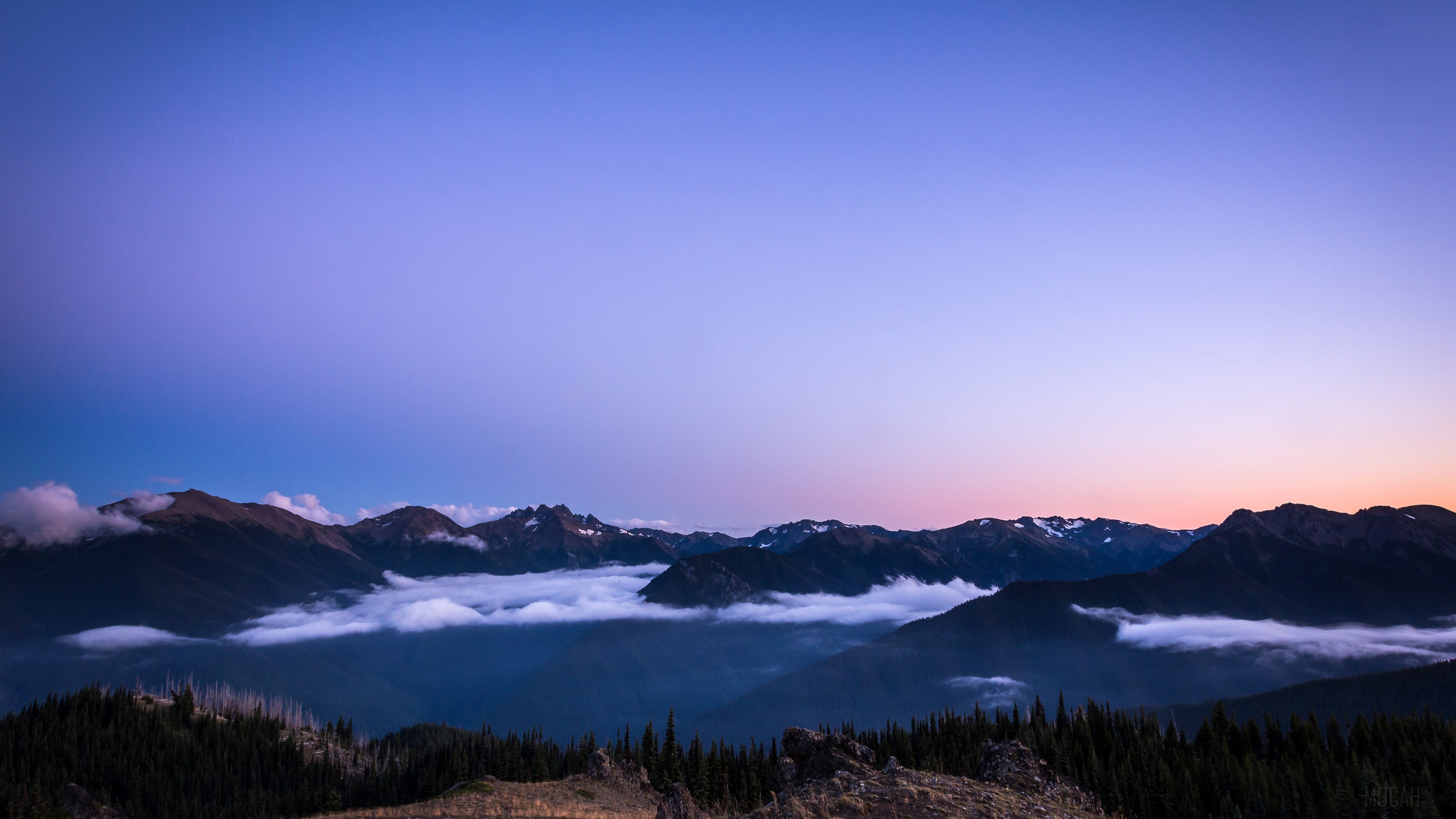 Sunset over mountains with clouds HD Wallpaper