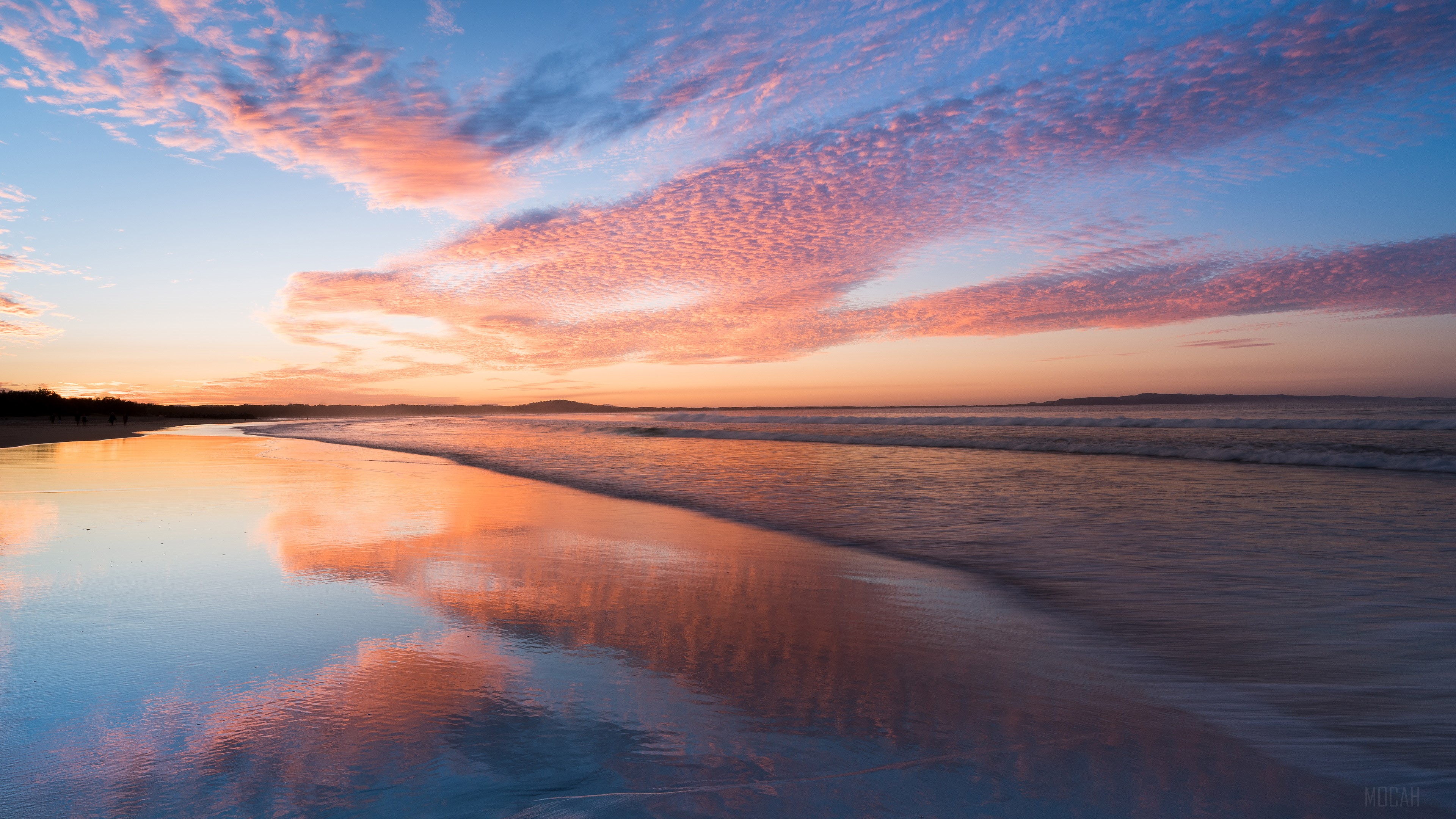 Sunset over a beach with pink clouds HD Wallpaper