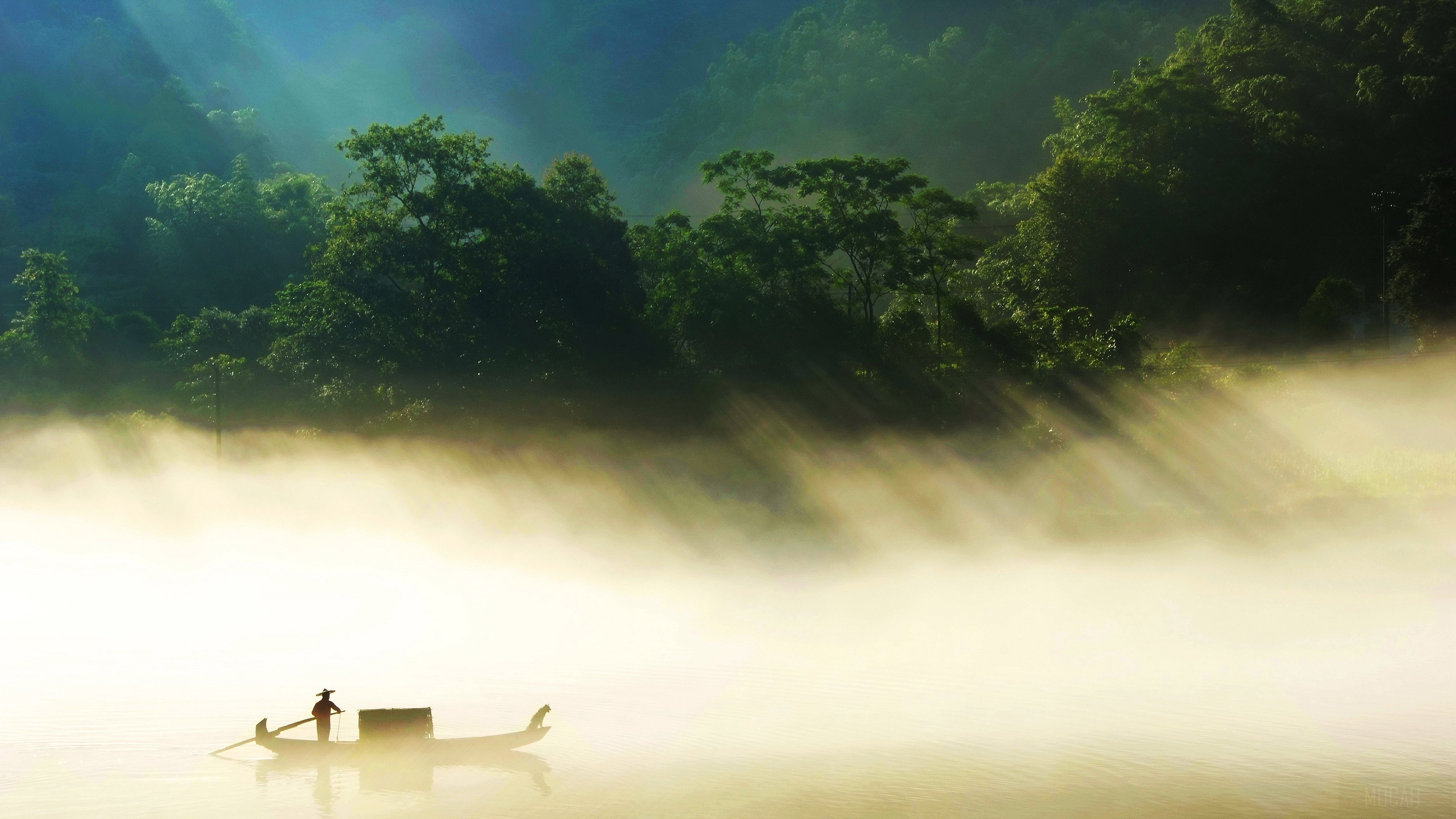 Fisherman on a misty lake with sun rays HD Wallpaper