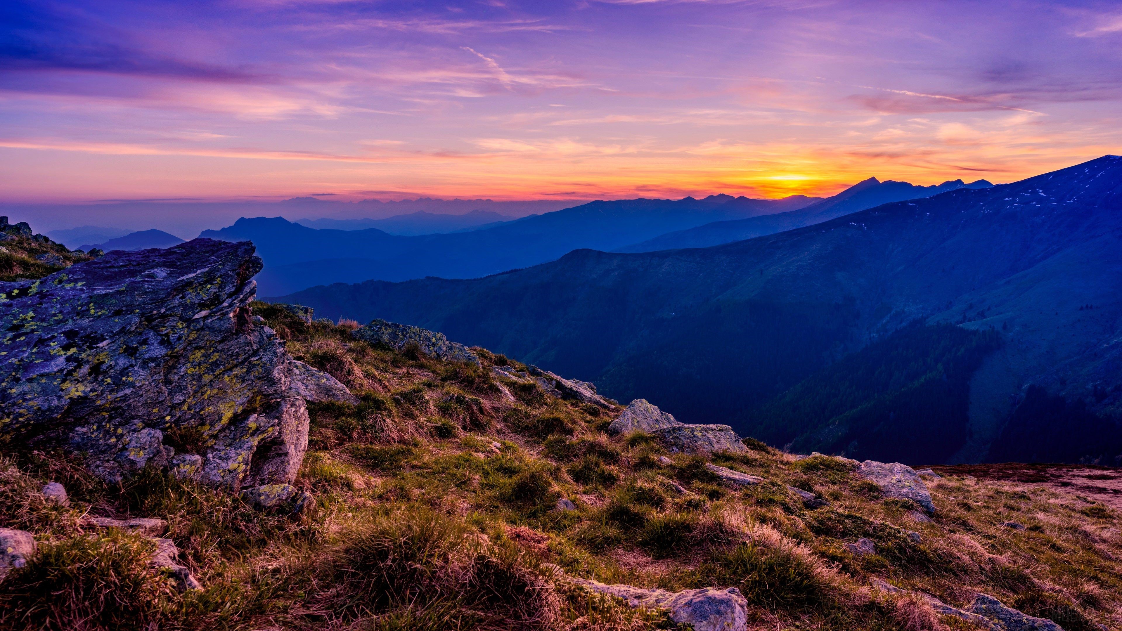 Mountains at sunset with purple and orange sky 4K HD Wallpaper