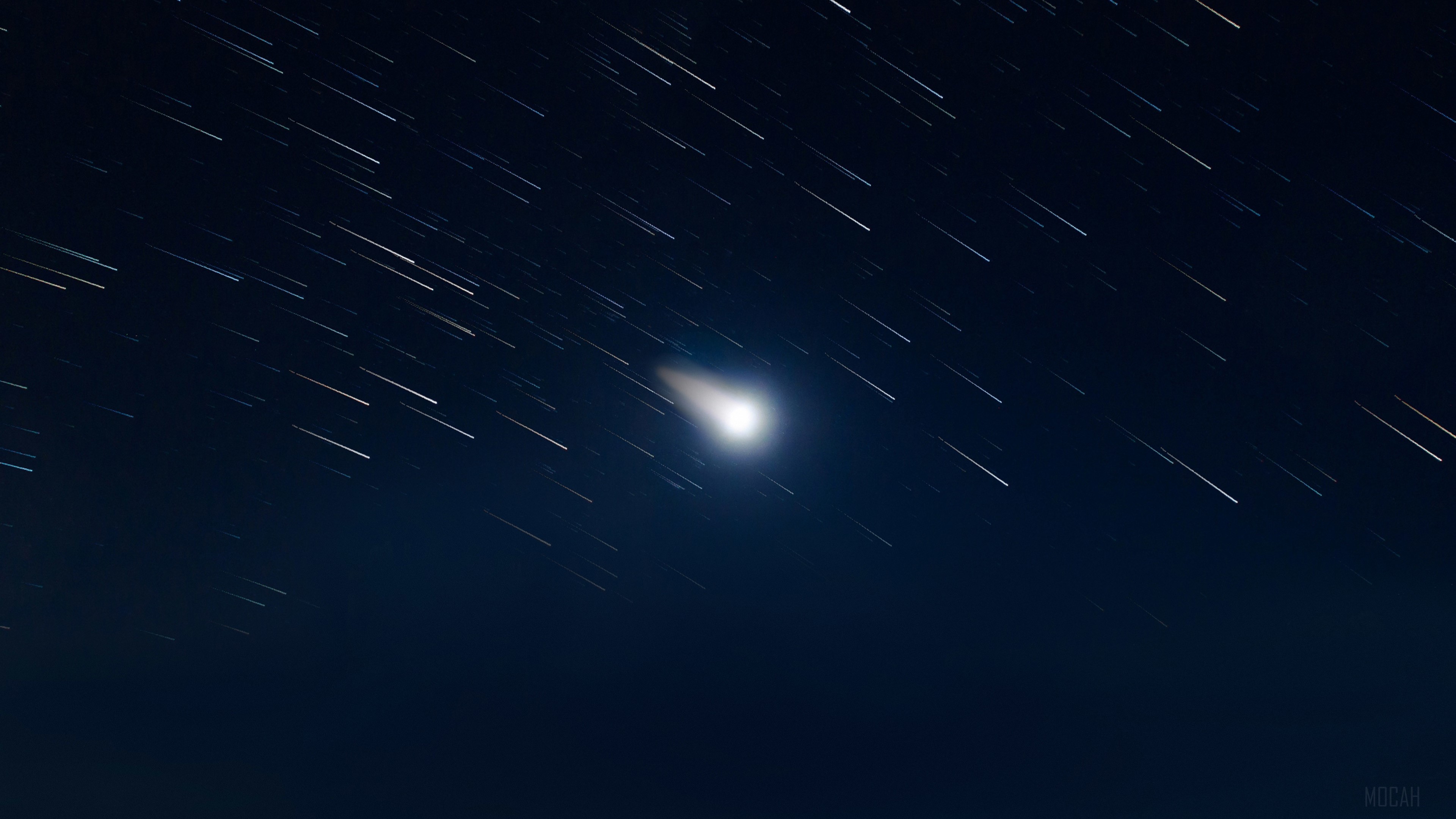 Star trails and a comet in the night sky HD Wallpaper