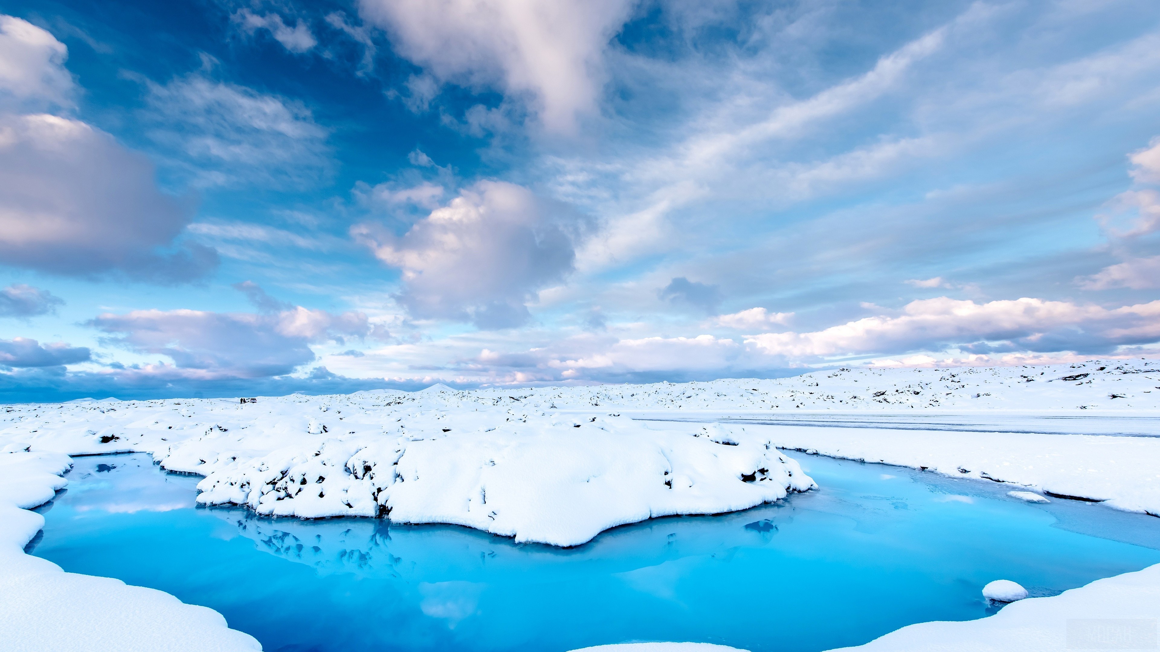 Snowy landscape with blue water in Iceland 4K HD Wallpaper