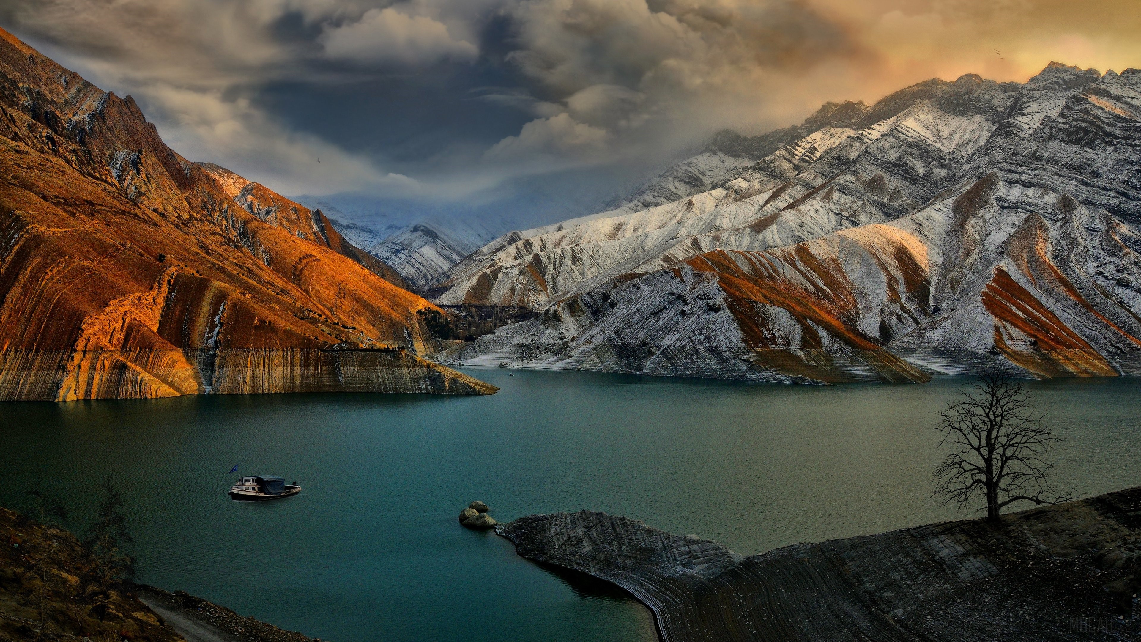 Lake and snow-capped mountains with a boat HD Wallpaper