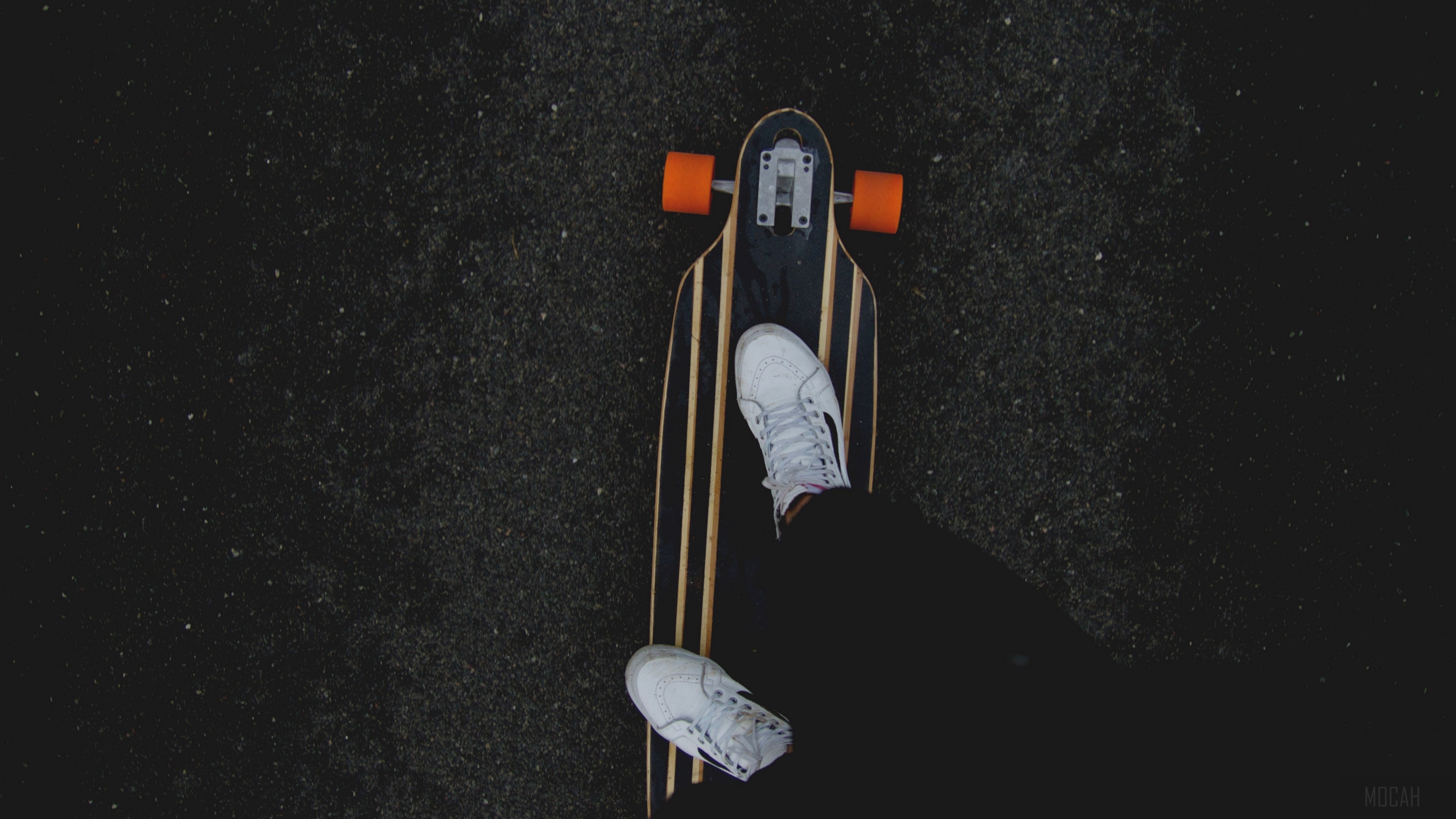 Longboard skateboard with orange wheels and person's legs HD Wallpaper