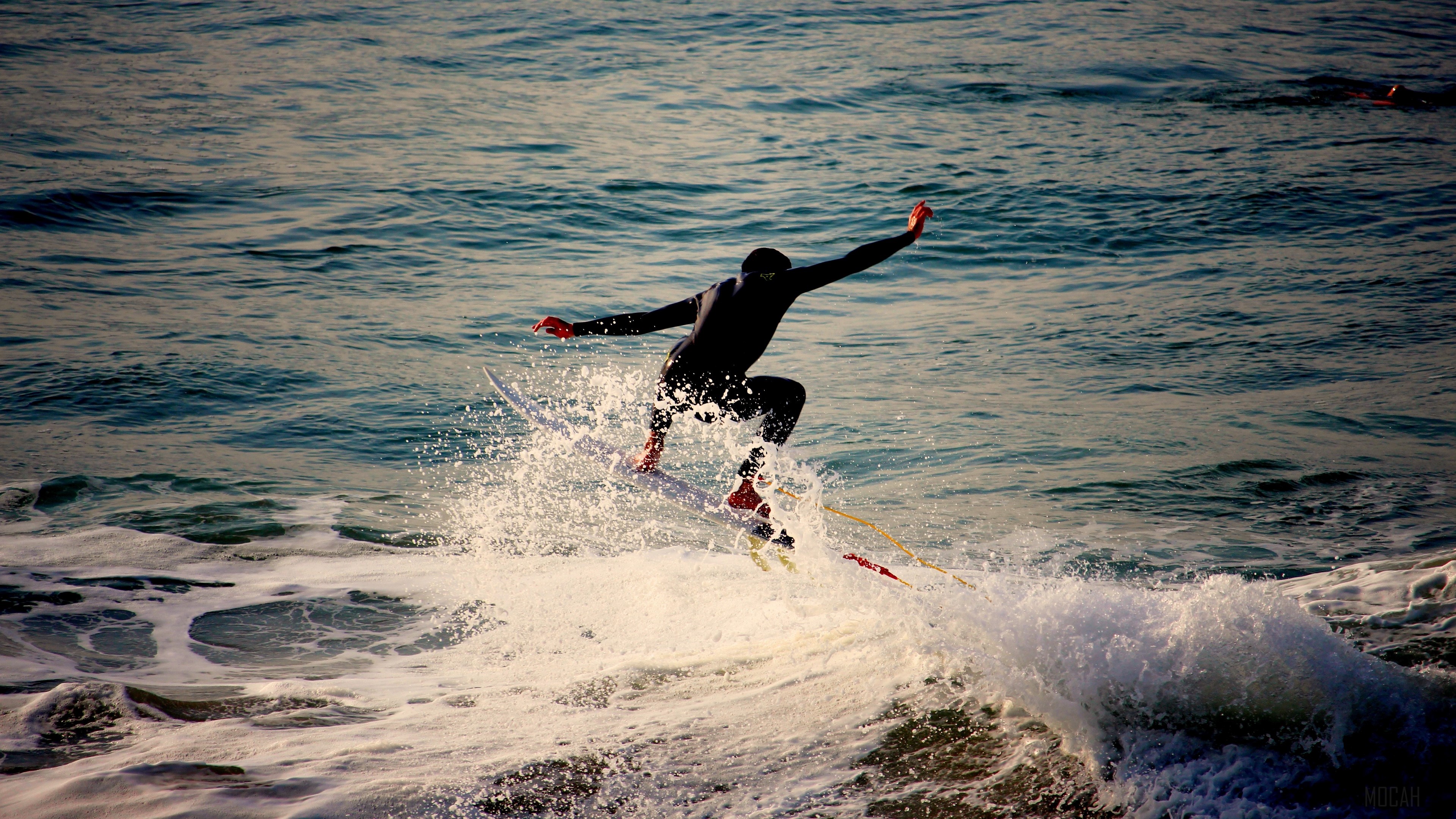 Surfer riding a wave in the sea HD Wallpaper