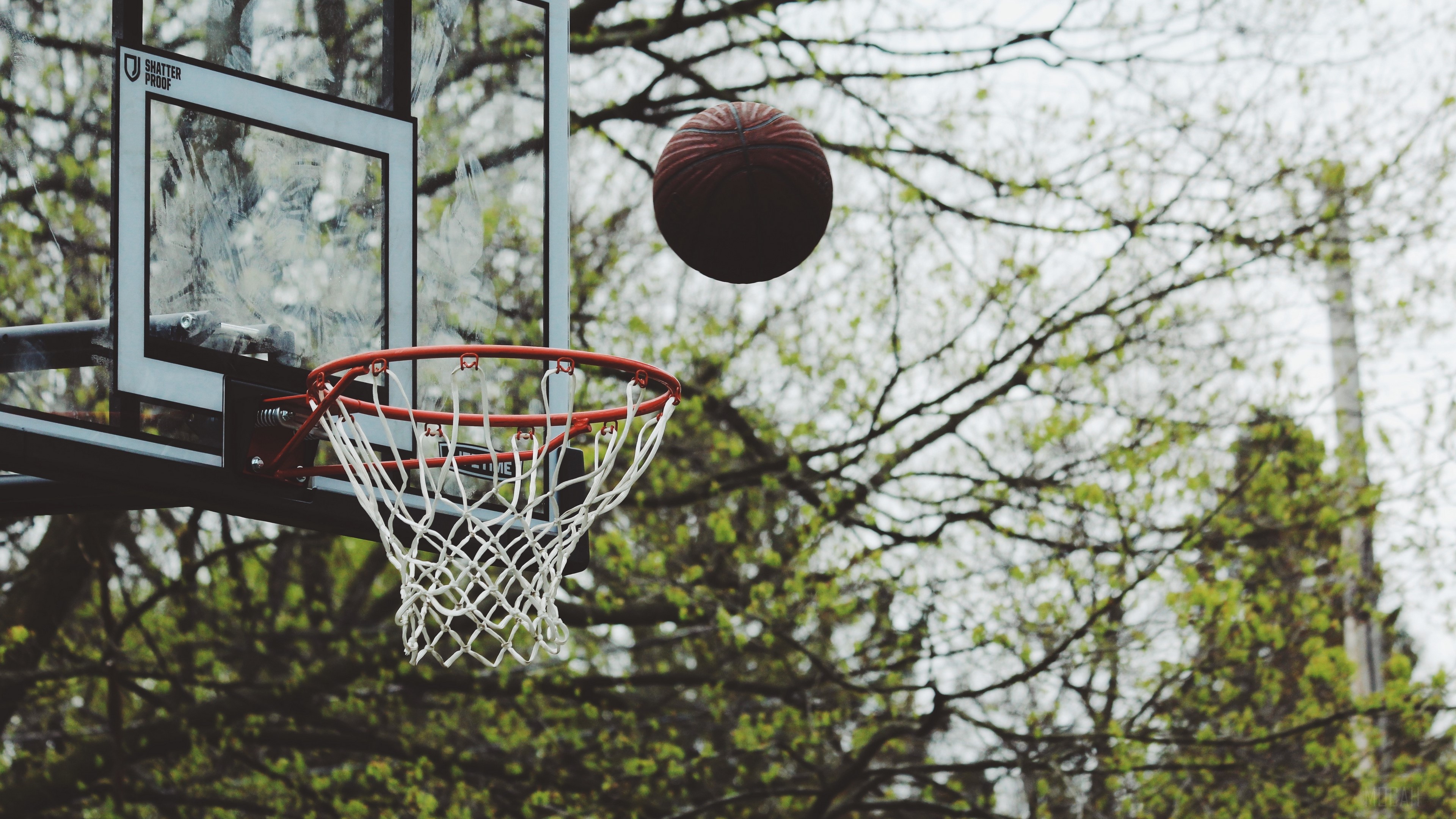 Basketball hoop with ball in the air HD Wallpaper