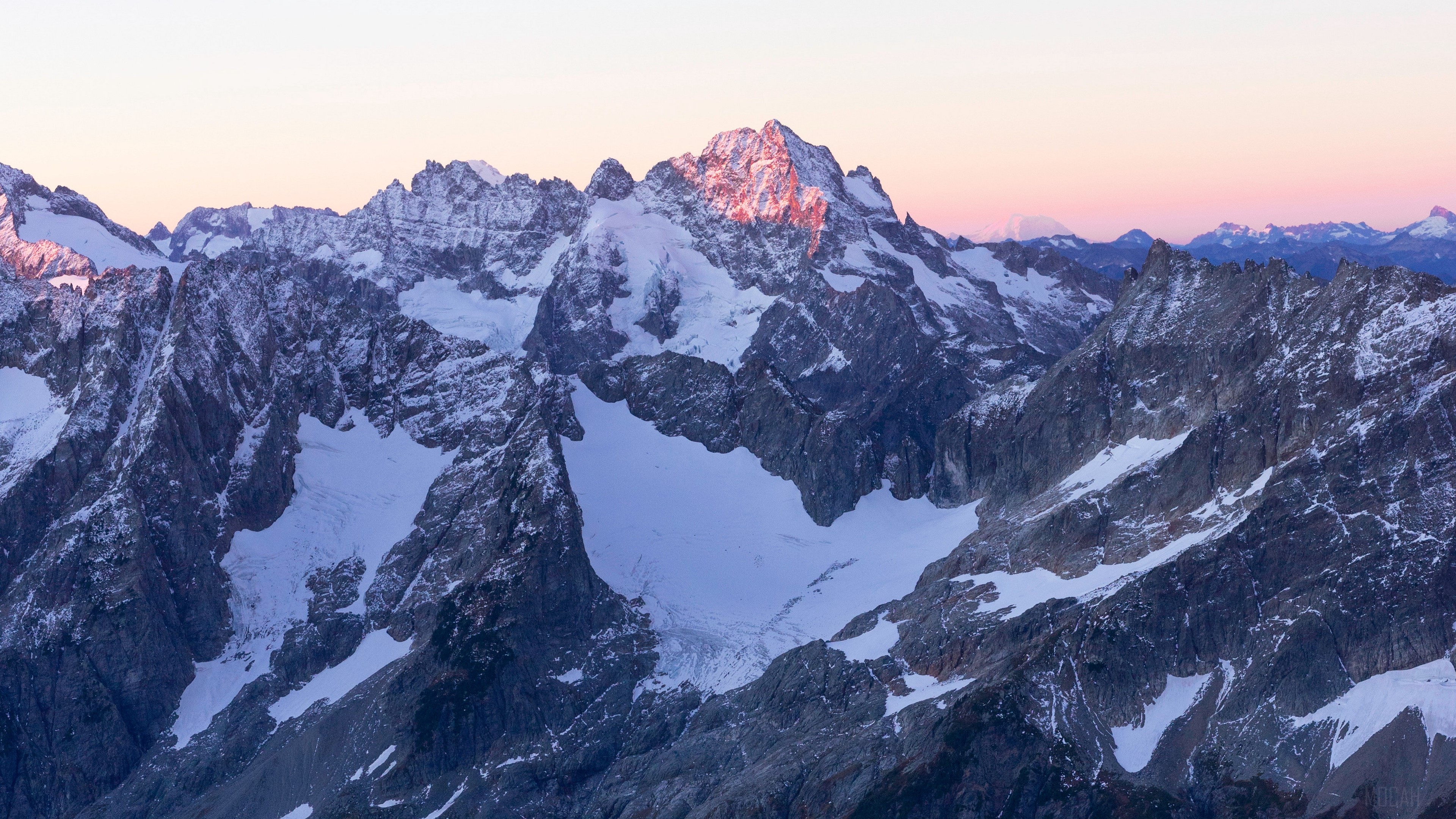 Snowy mountain peaks at sunrise 4K HD Wallpaper