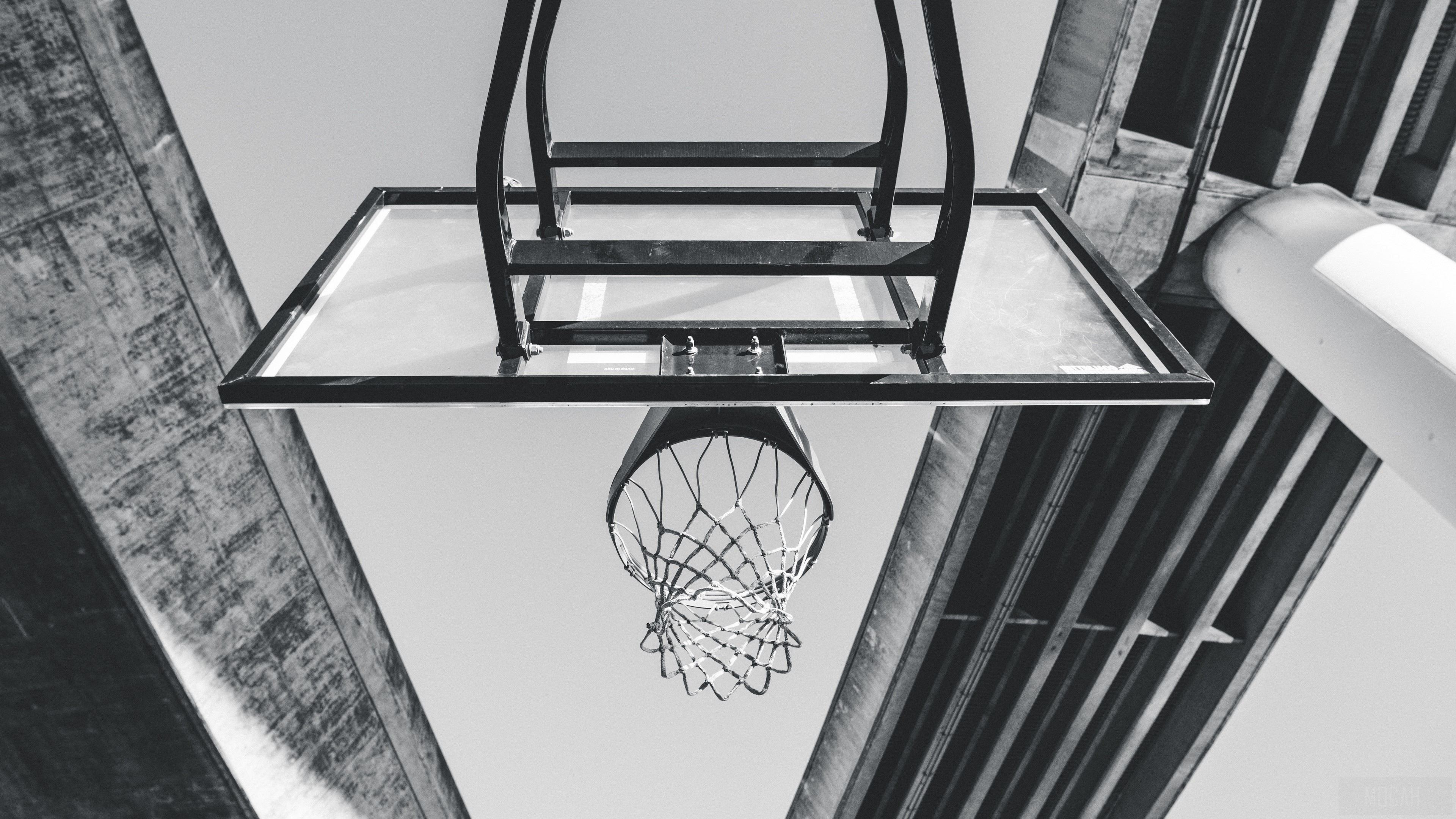 Basketball hoop and backboard under concrete structure, bw 4k HD Wallpaper