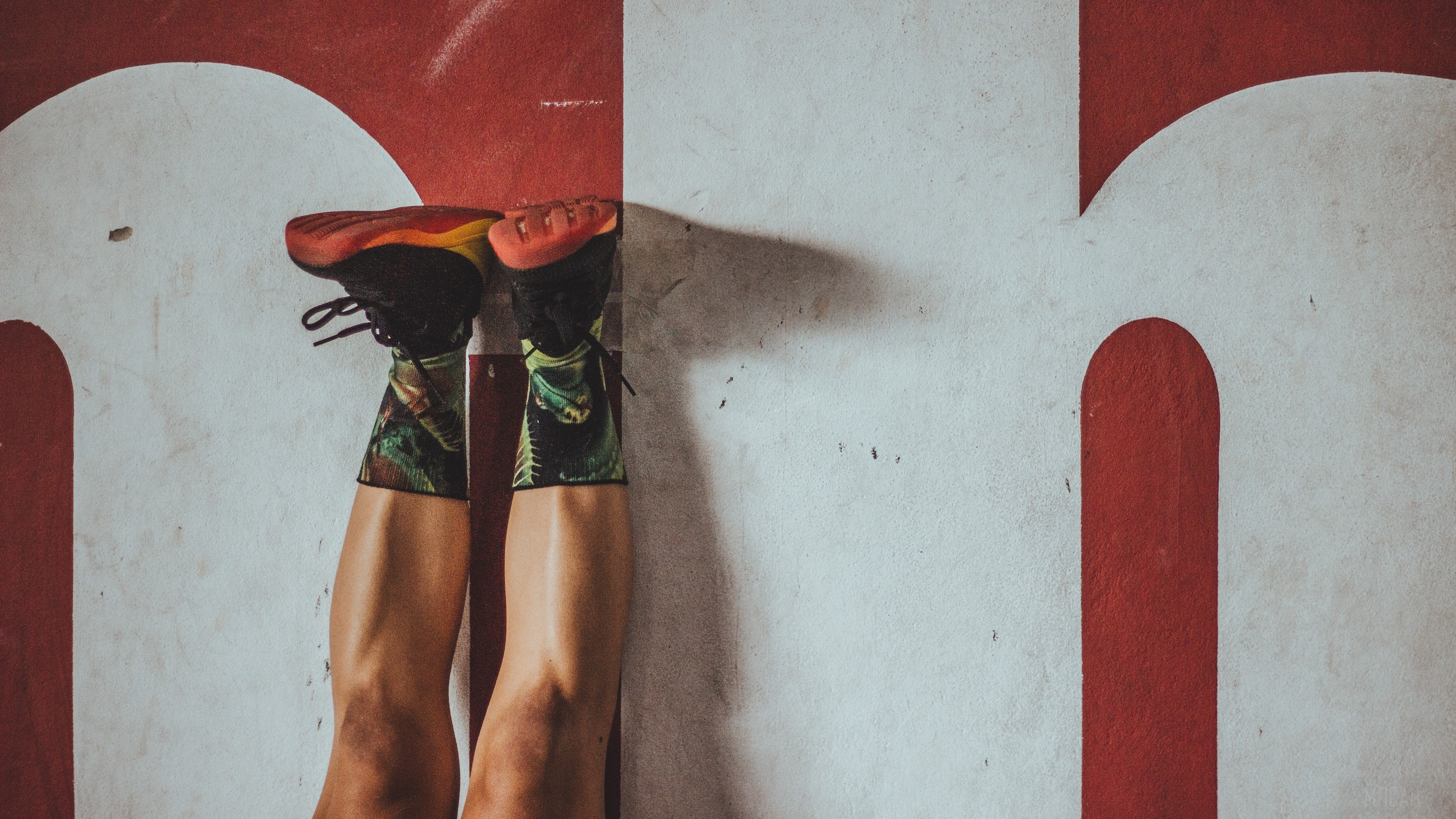 Person doing handstand on wall HD Wallpaper
