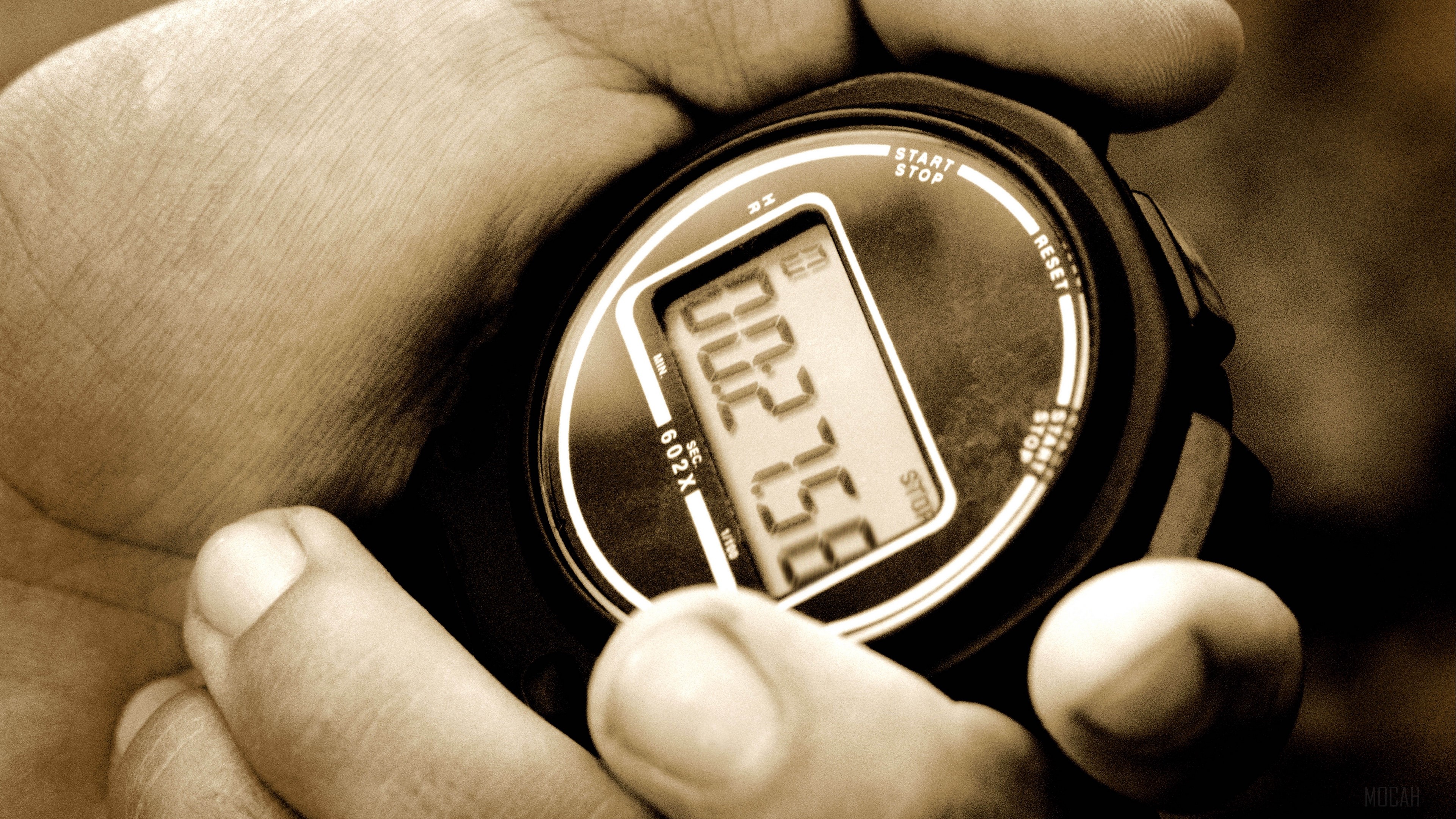 Close-up of a stopwatch in sepia tone HD Wallpaper