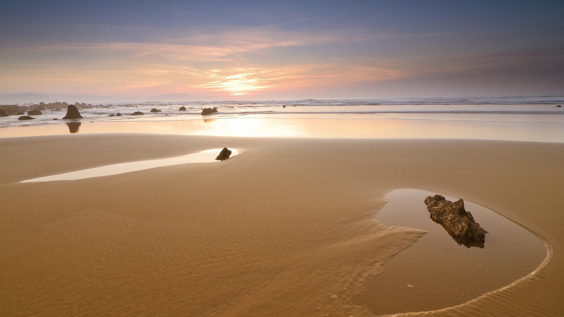 Beach with tide pools and rocks at sunset HD Wallpaper