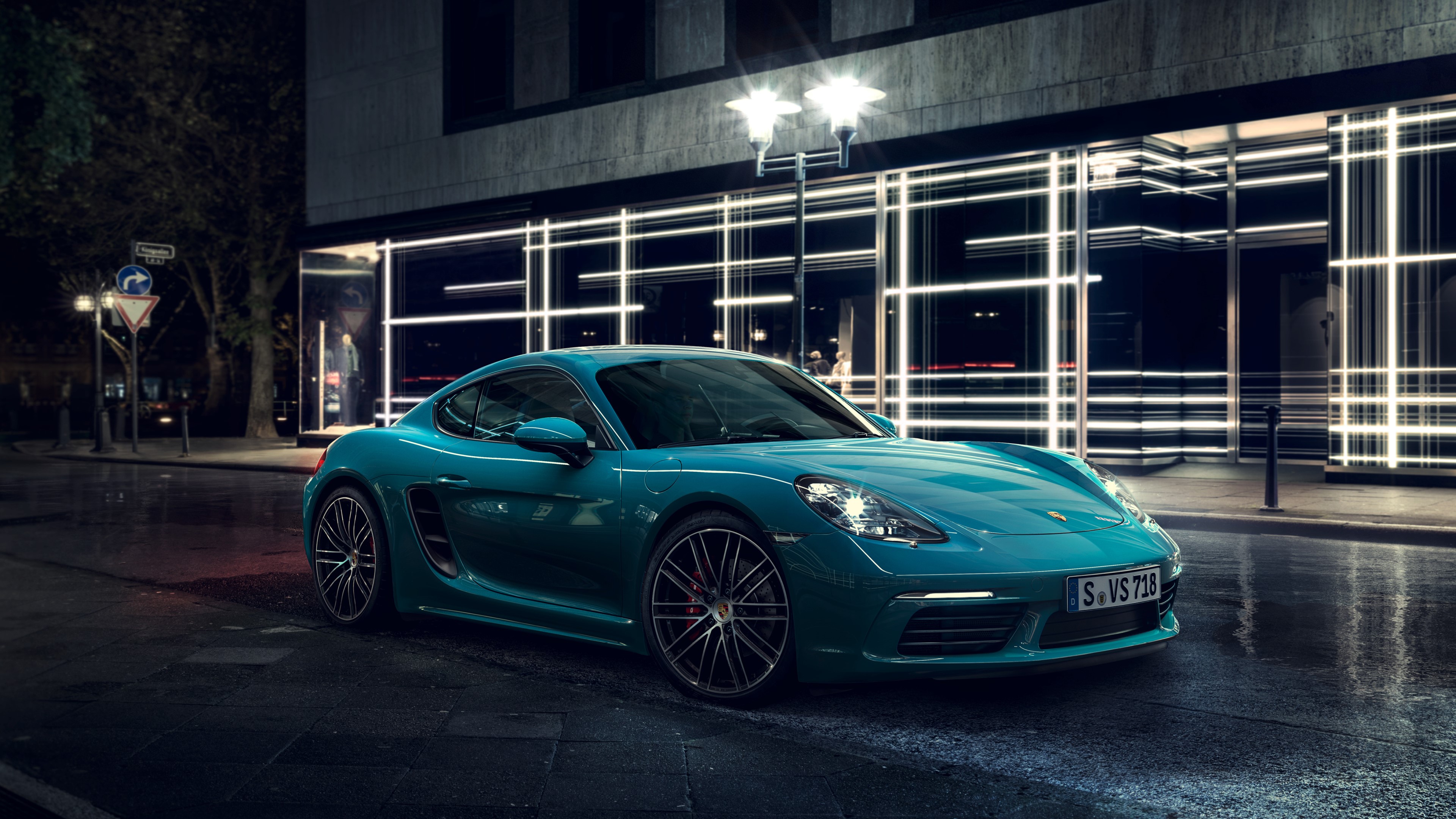 Teal Porsche Cayman S on wet street at night HD Wallpaper