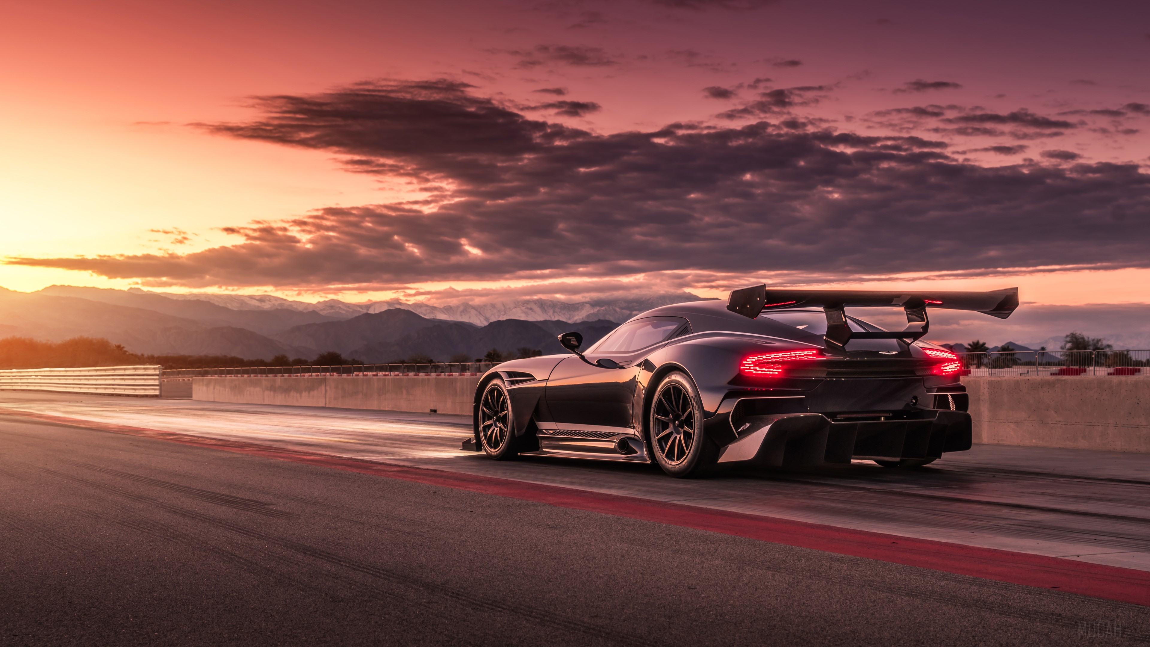 Aston Martin Vulcan on a racetrack at sunset HD Wallpaper
