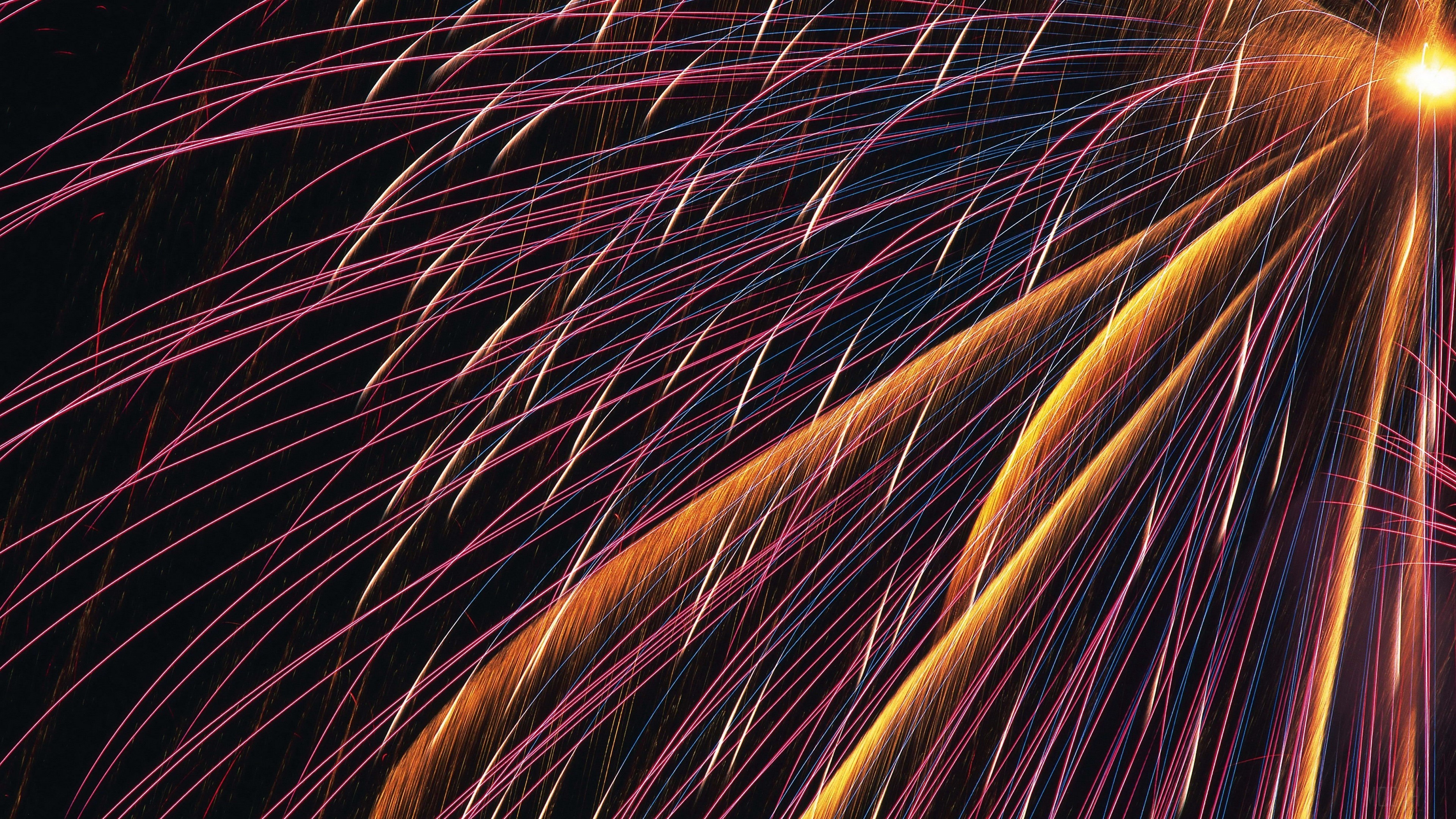 Bright fireworks with pink and orange streaks HD Wallpaper