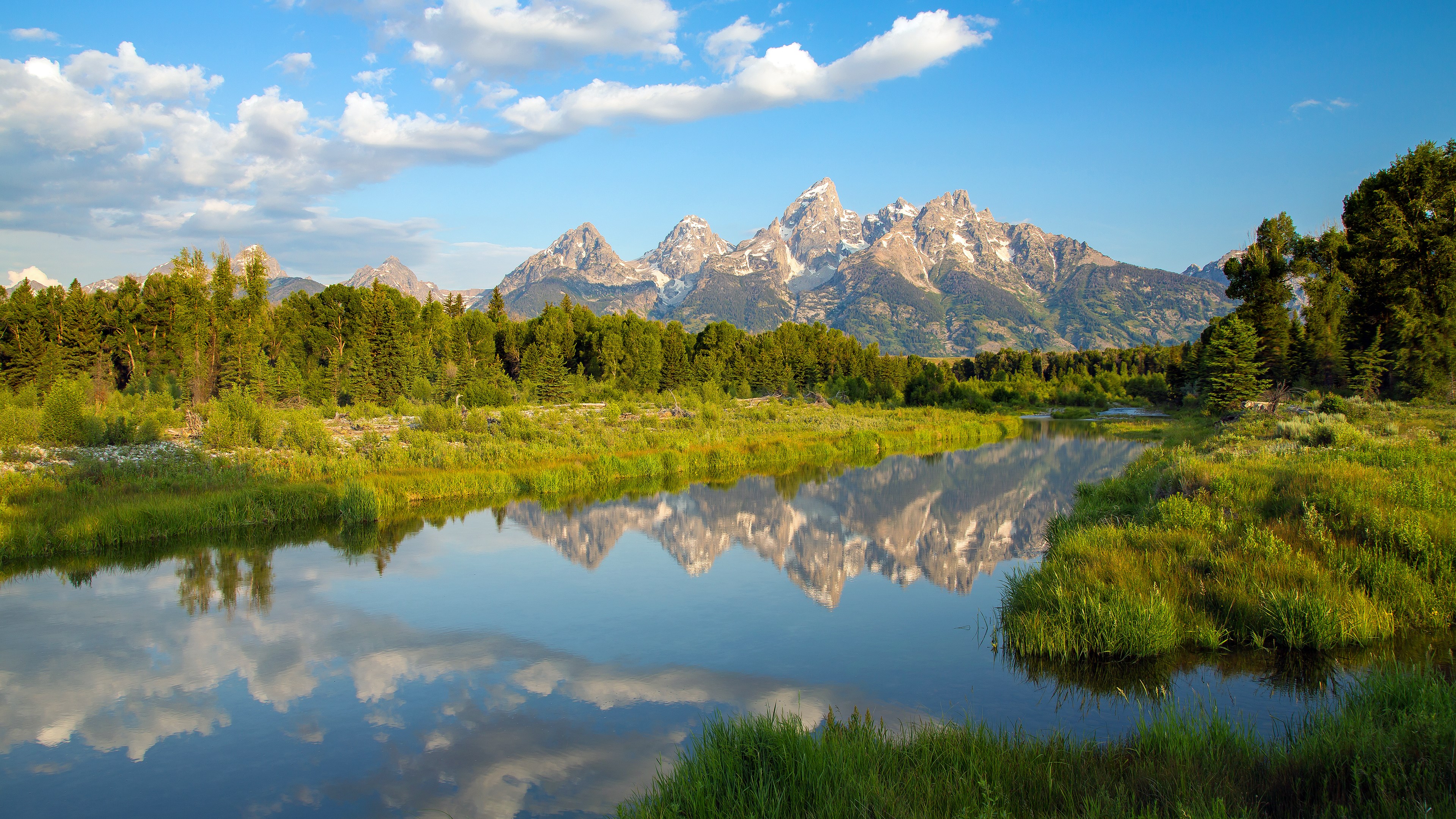 Grand Teton Mountains reflected in a river HD Wallpaper