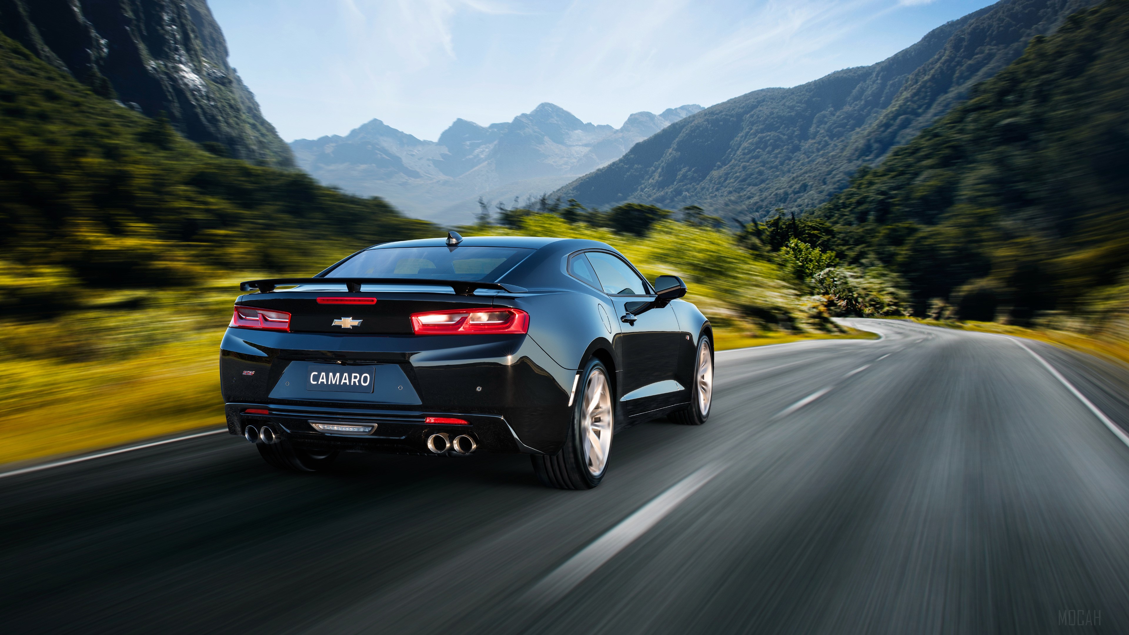 Black Chevrolet Camaro SS driving on a mountain road HD Wallpaper