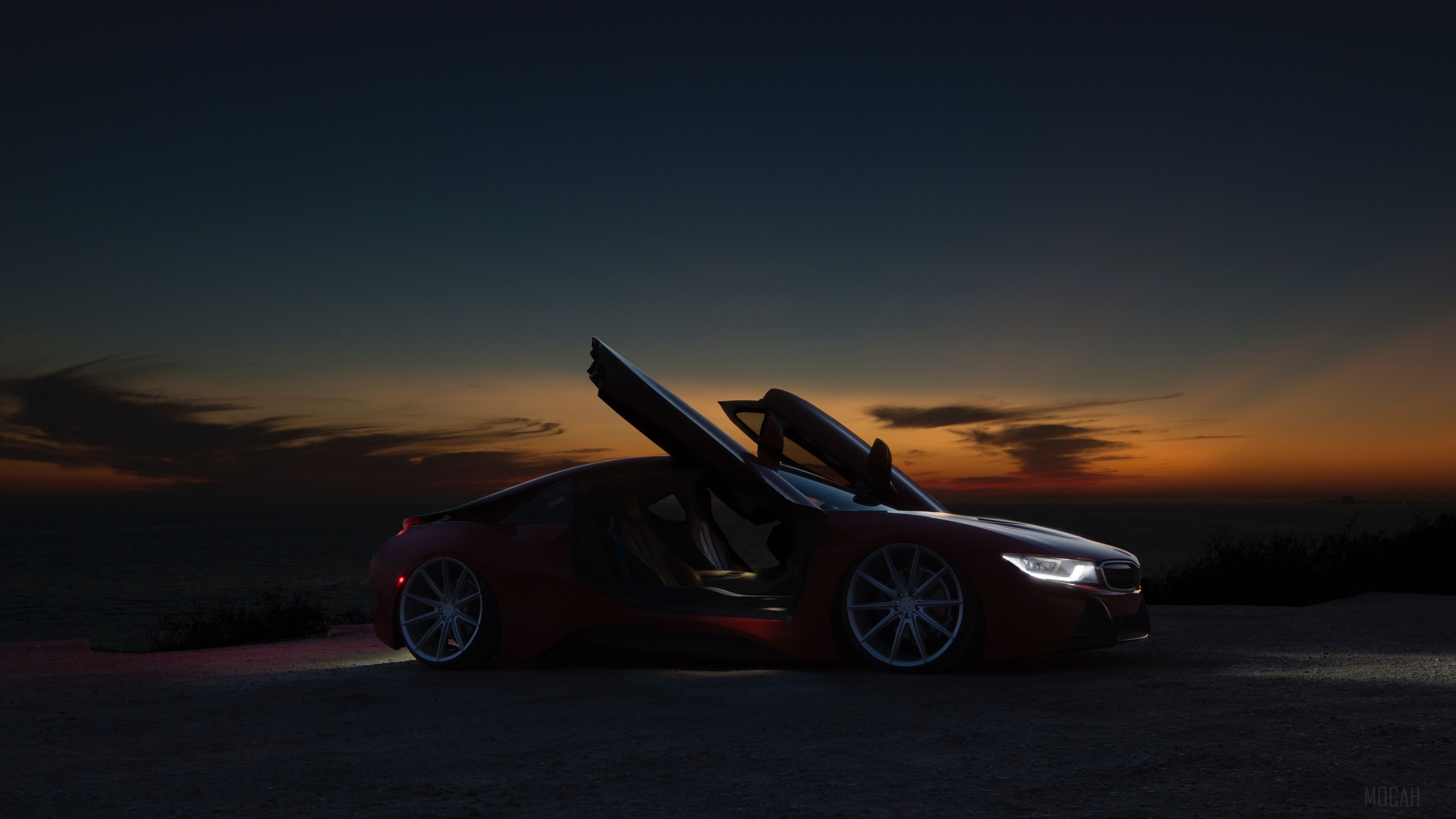 Red Sports Car with Doors Open at Sunset HD Wallpaper