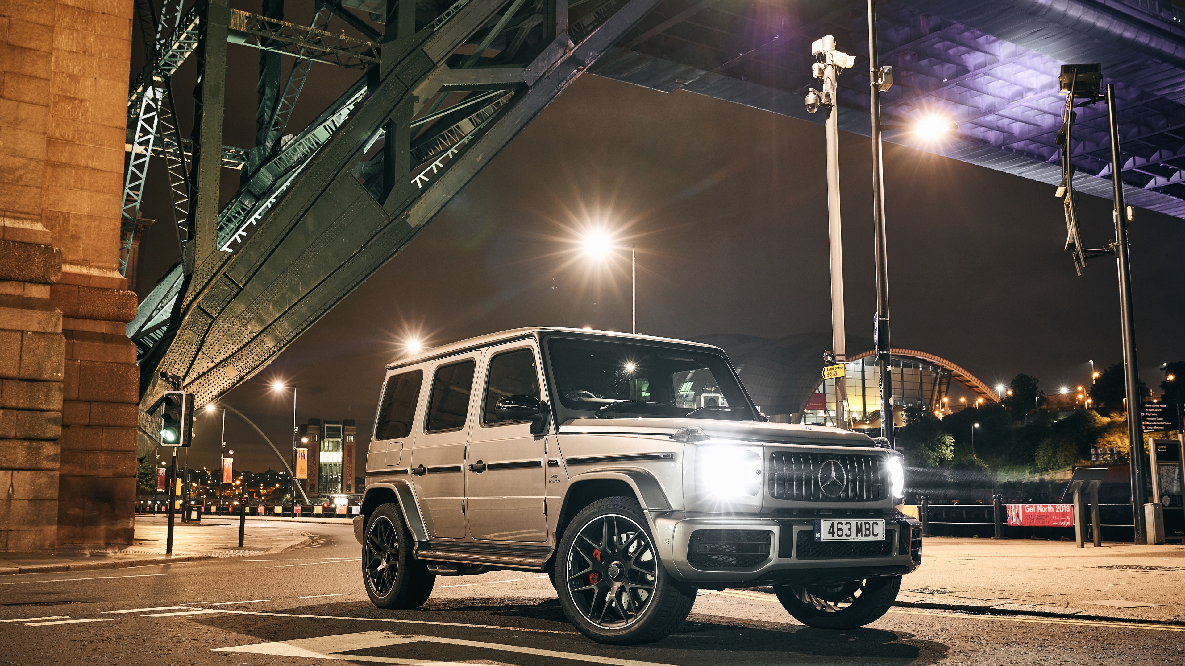 Mercedes G 63 parked under a bridge at night HD Wallpaper