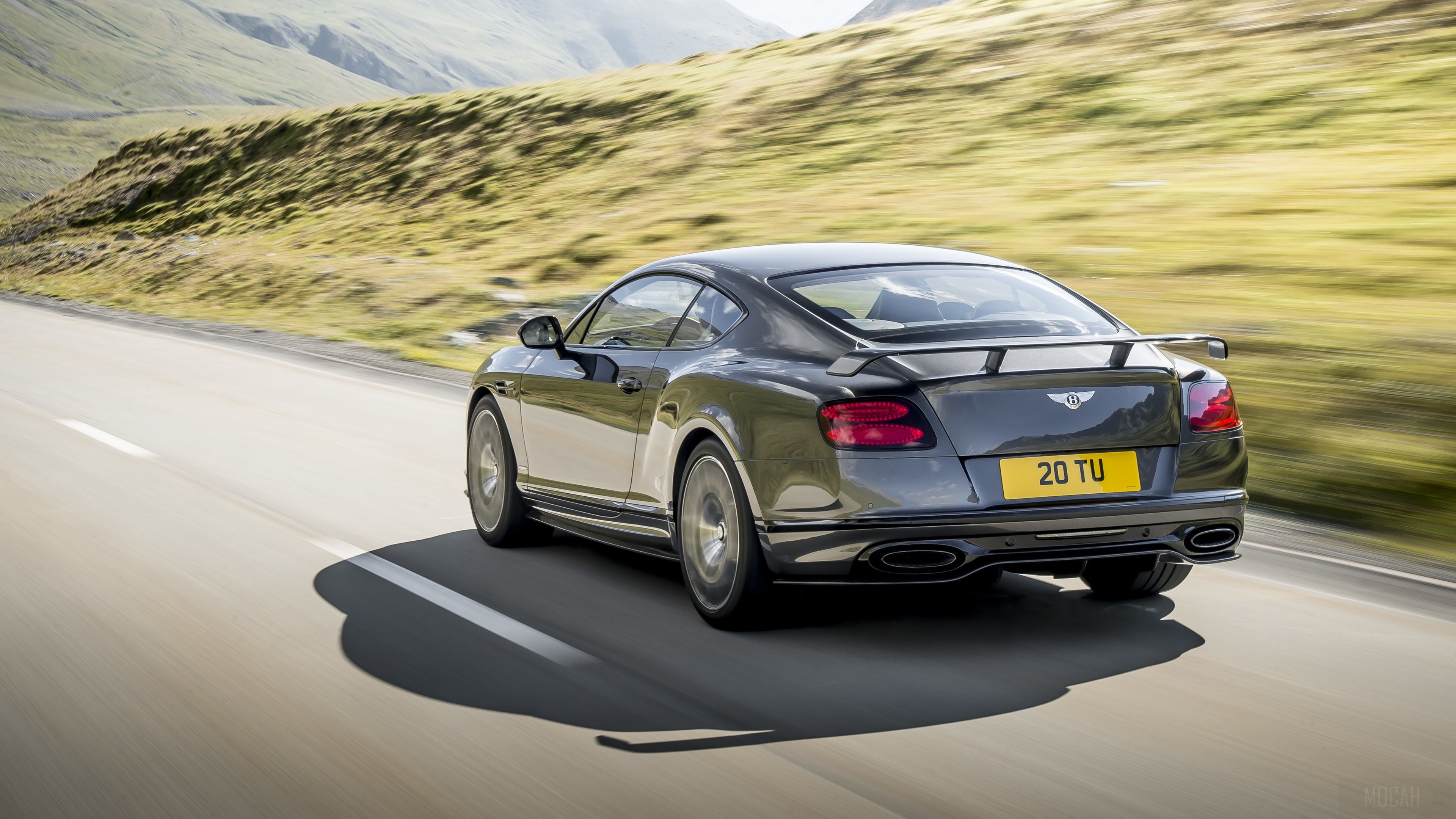 Bentley Continental GT Supersport driving on a road HD Wallpaper