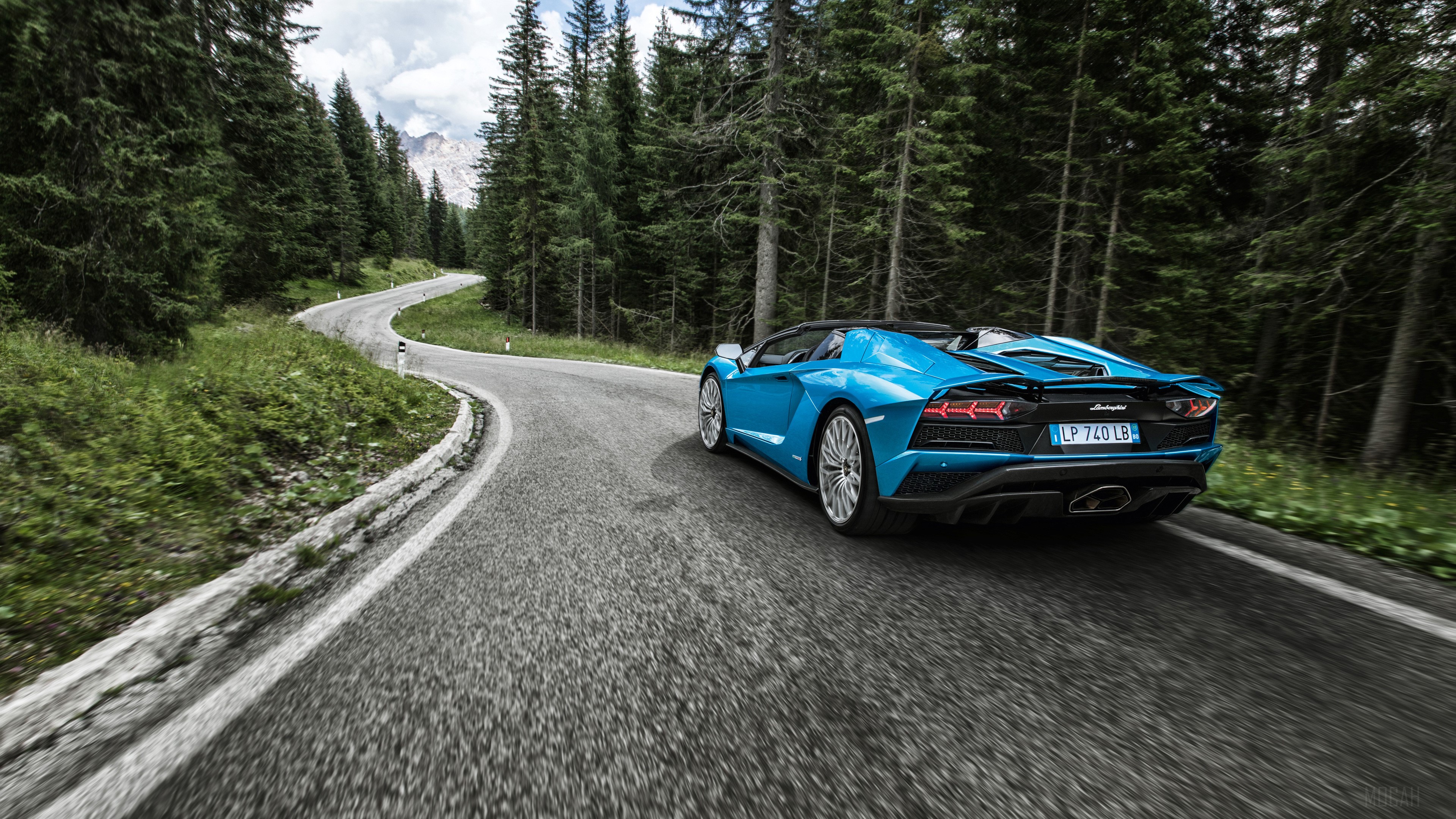 Blue Lamborghini Aventador S driving on a mountain road HD Wallpaper